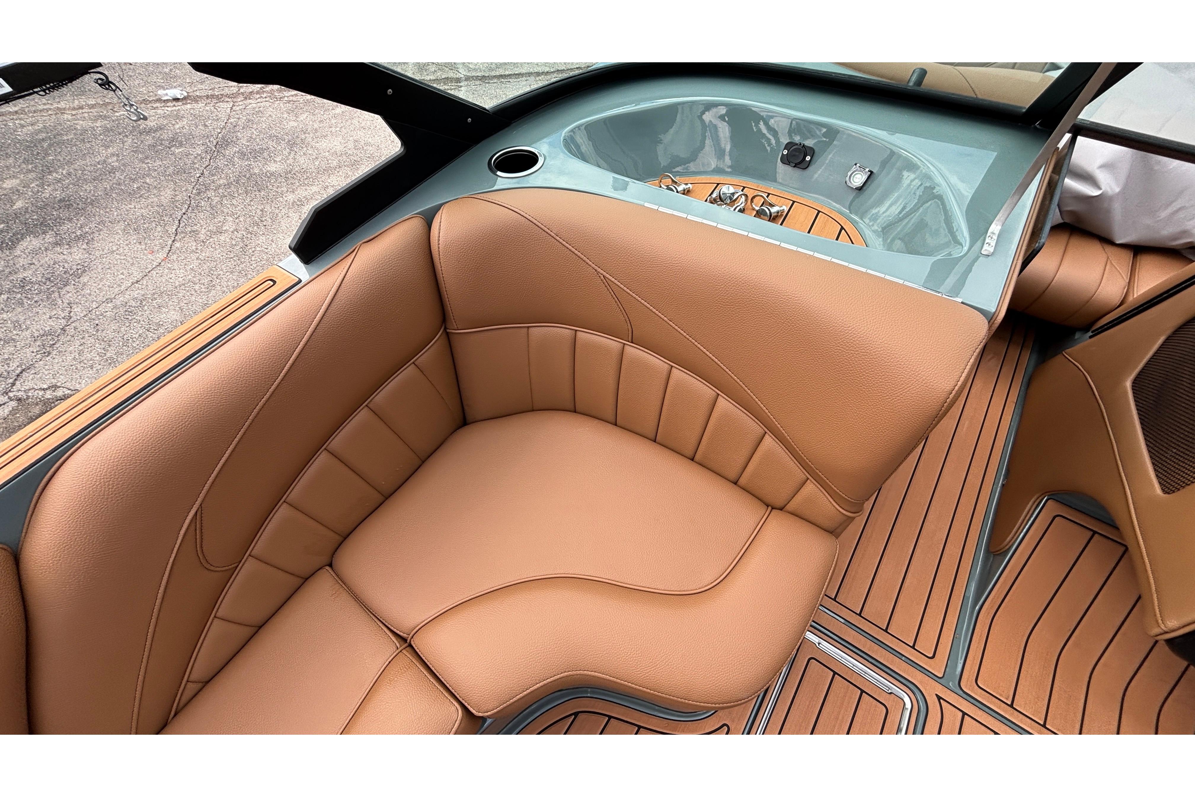 Luxurious tan leather seating in 2026 MB B52 23 Classic boat interior.