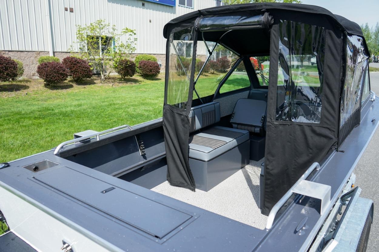 2026 Alumaweld X202 Stryker boat with canopy, showcasing spacious interior and seating.