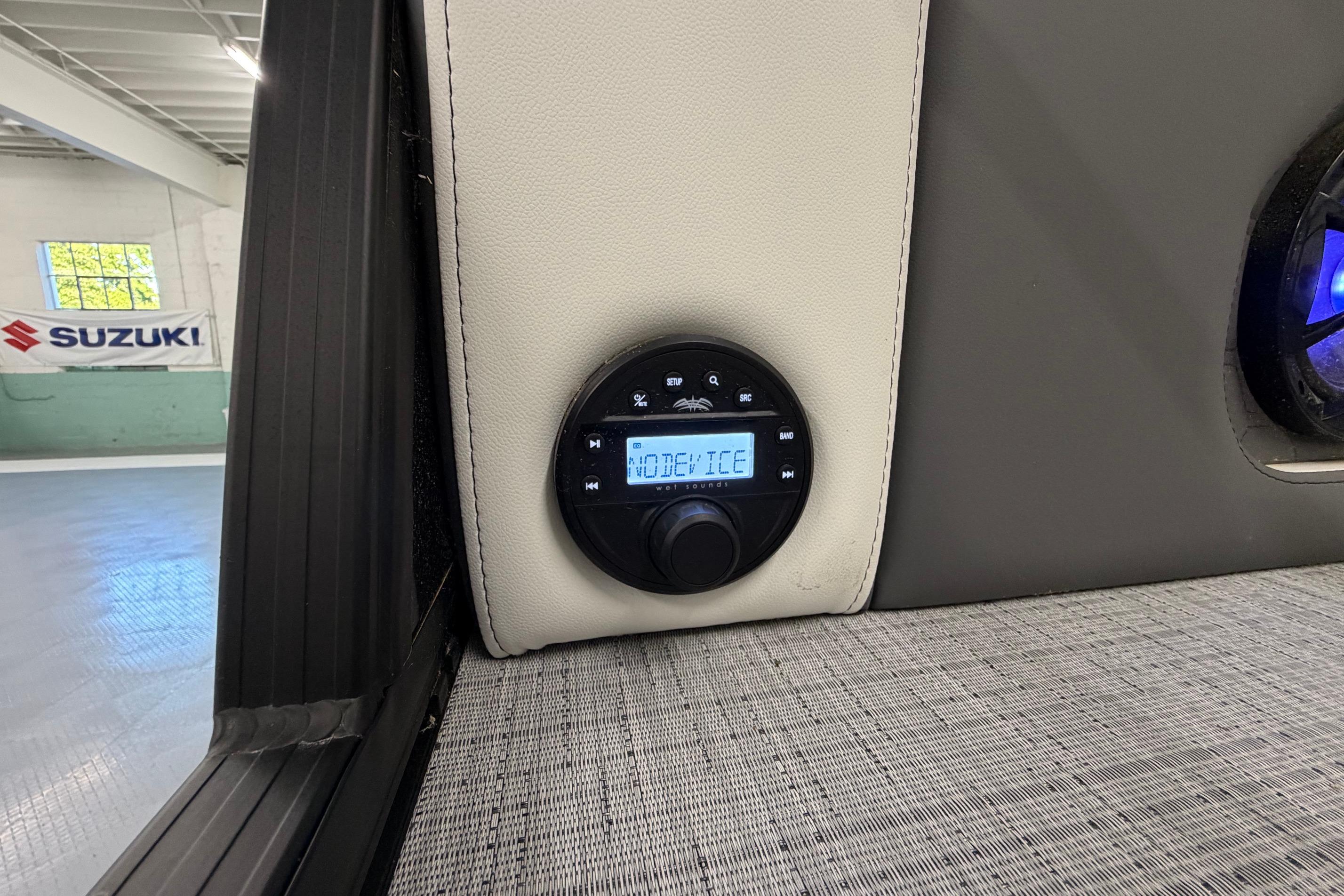 Audio control panel in 2026 South Bay 525SB2 boat interior, featuring modern design elements.