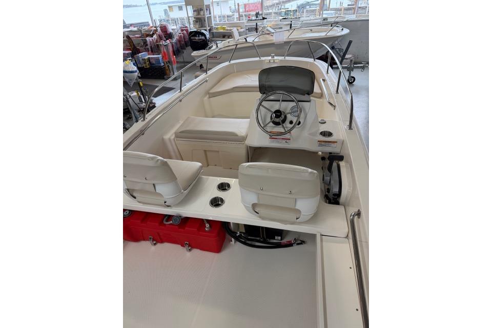 2026 Boston Whaler 160 Super Sport interior with steering wheel and seating.
