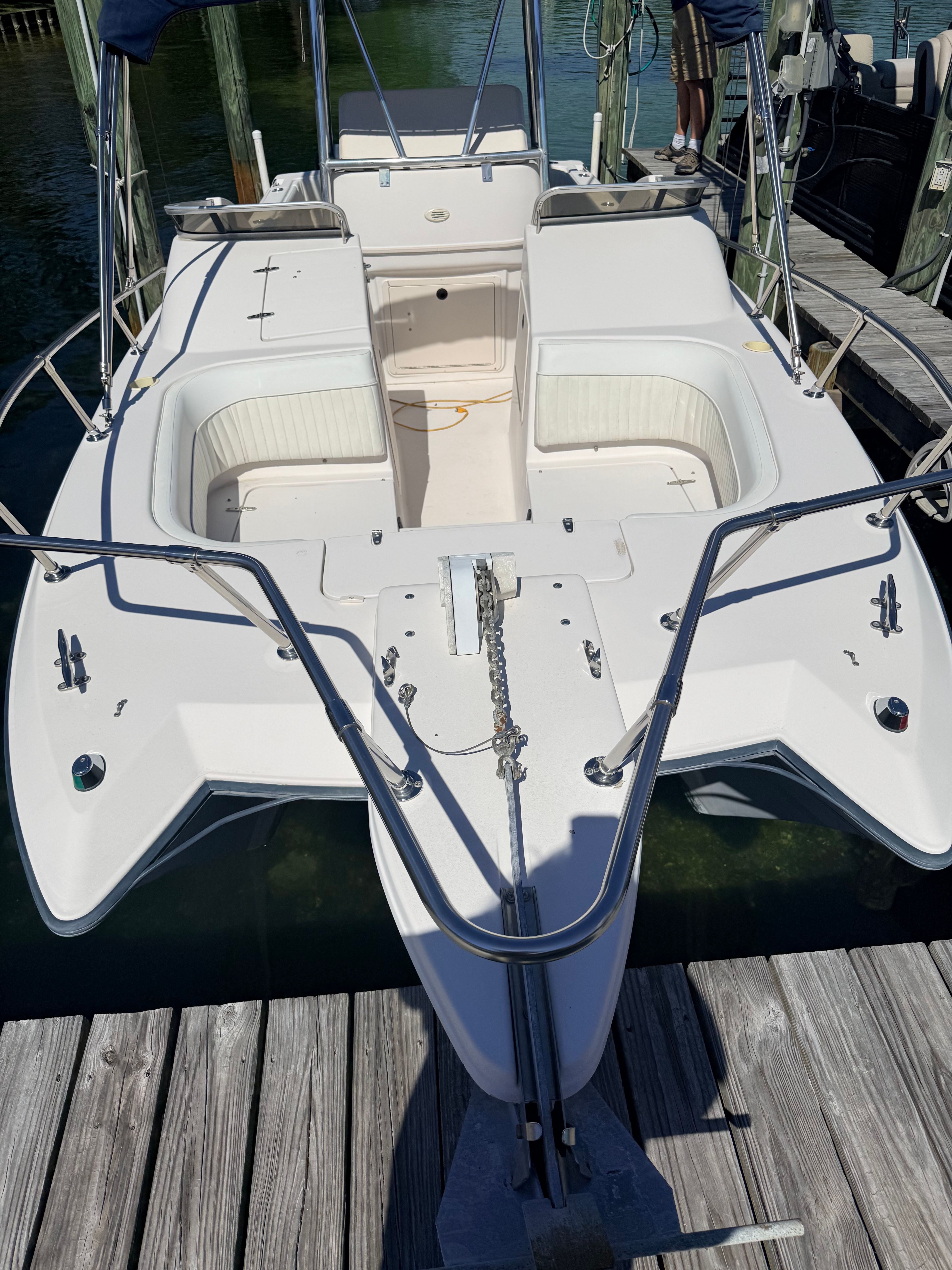 Grady-White X26 Tigercat 2000 docked at a wooden pier.