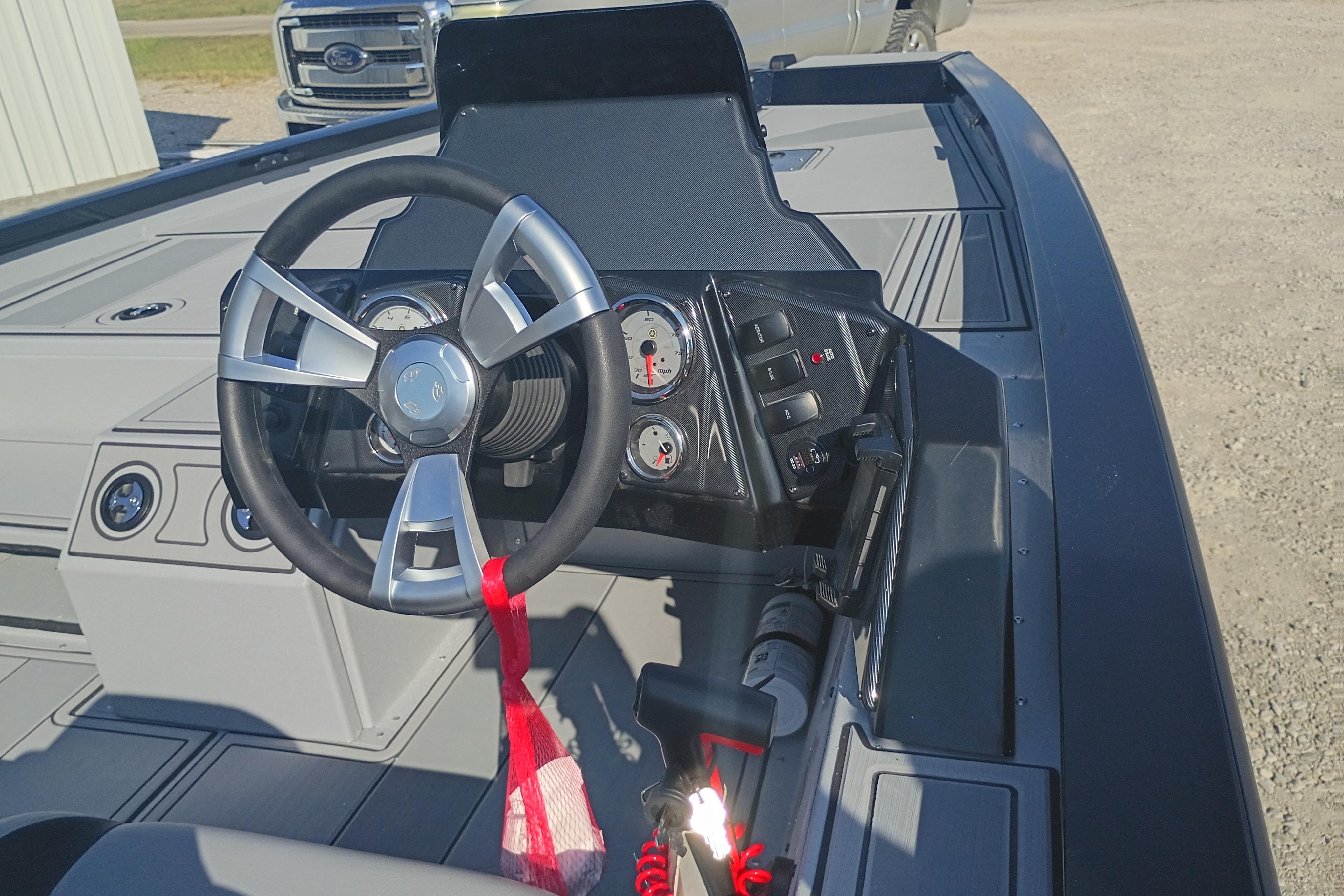 Steering console of 2026 G3 1810SE boat with modern controls and gauges.