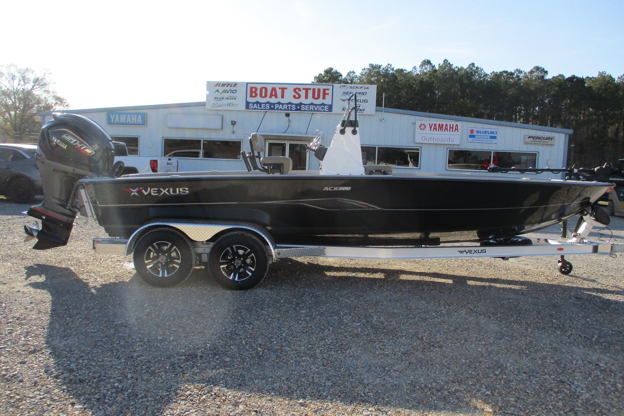 2026 Vexus ACX2210 boat on trailer outside dealership, featuring Yamaha engine.
