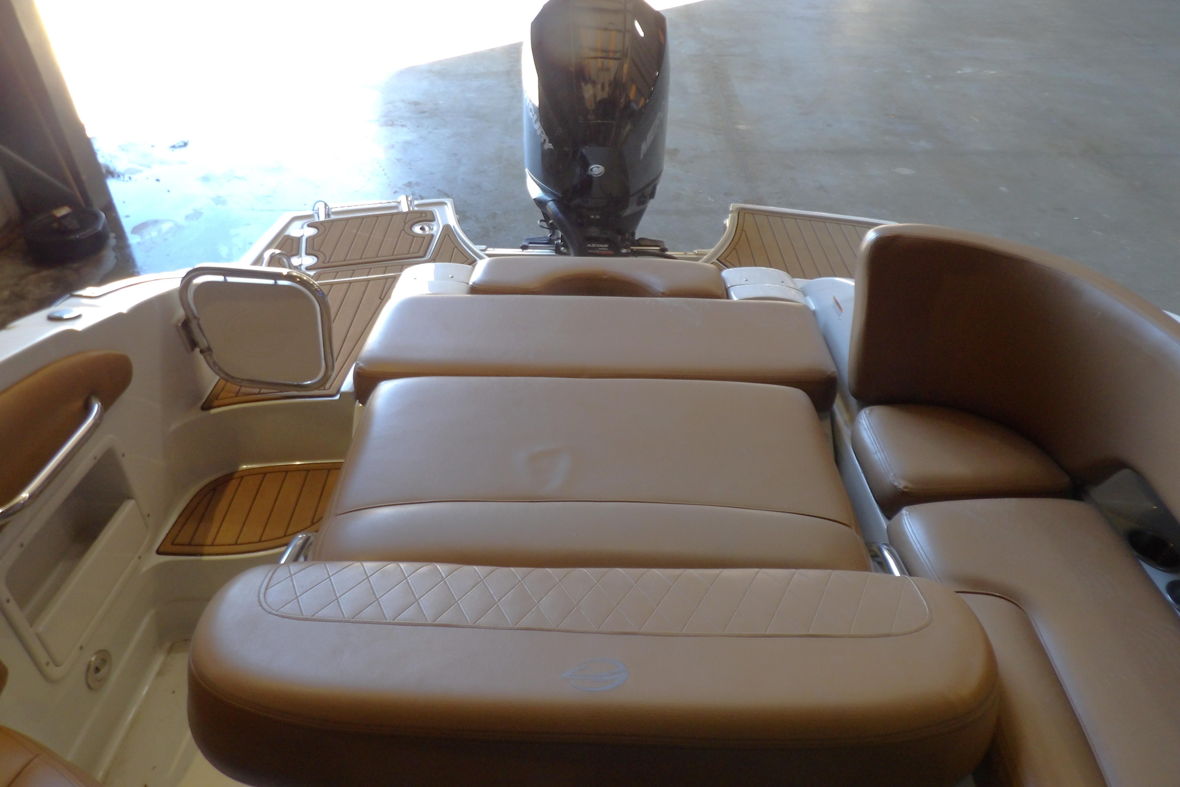 2023 Crownline 250 XSS boat interior with tan seating and swim platform.