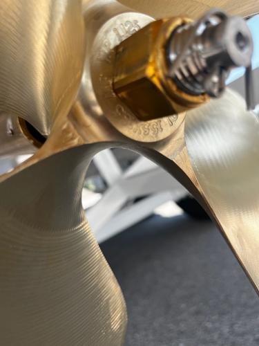 Close-up of a 2025 Moomba Max boat propeller, showcasing its metallic blades.