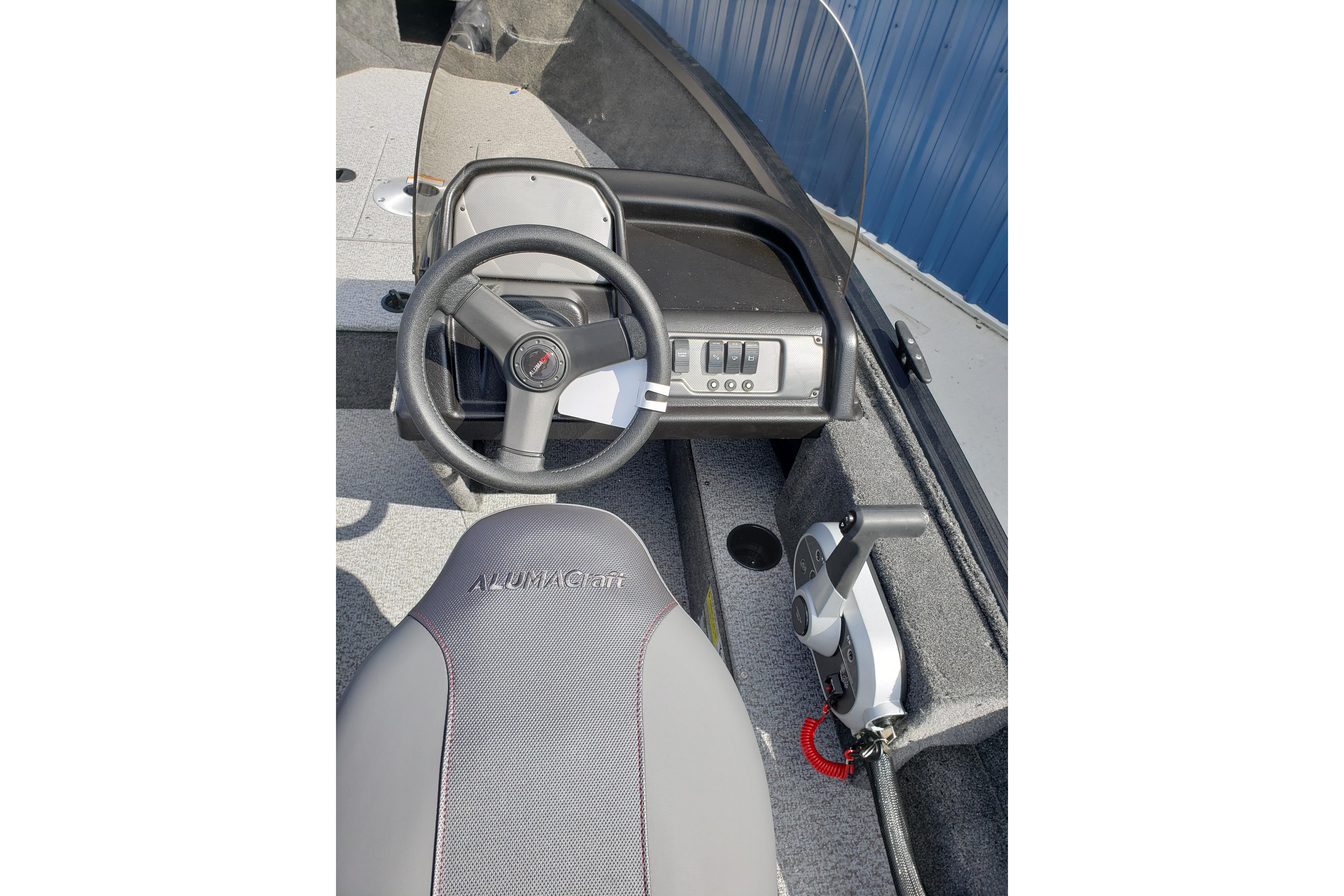 2026 Alumacraft Escape 165 CS boat interior with steering wheel and control panel.