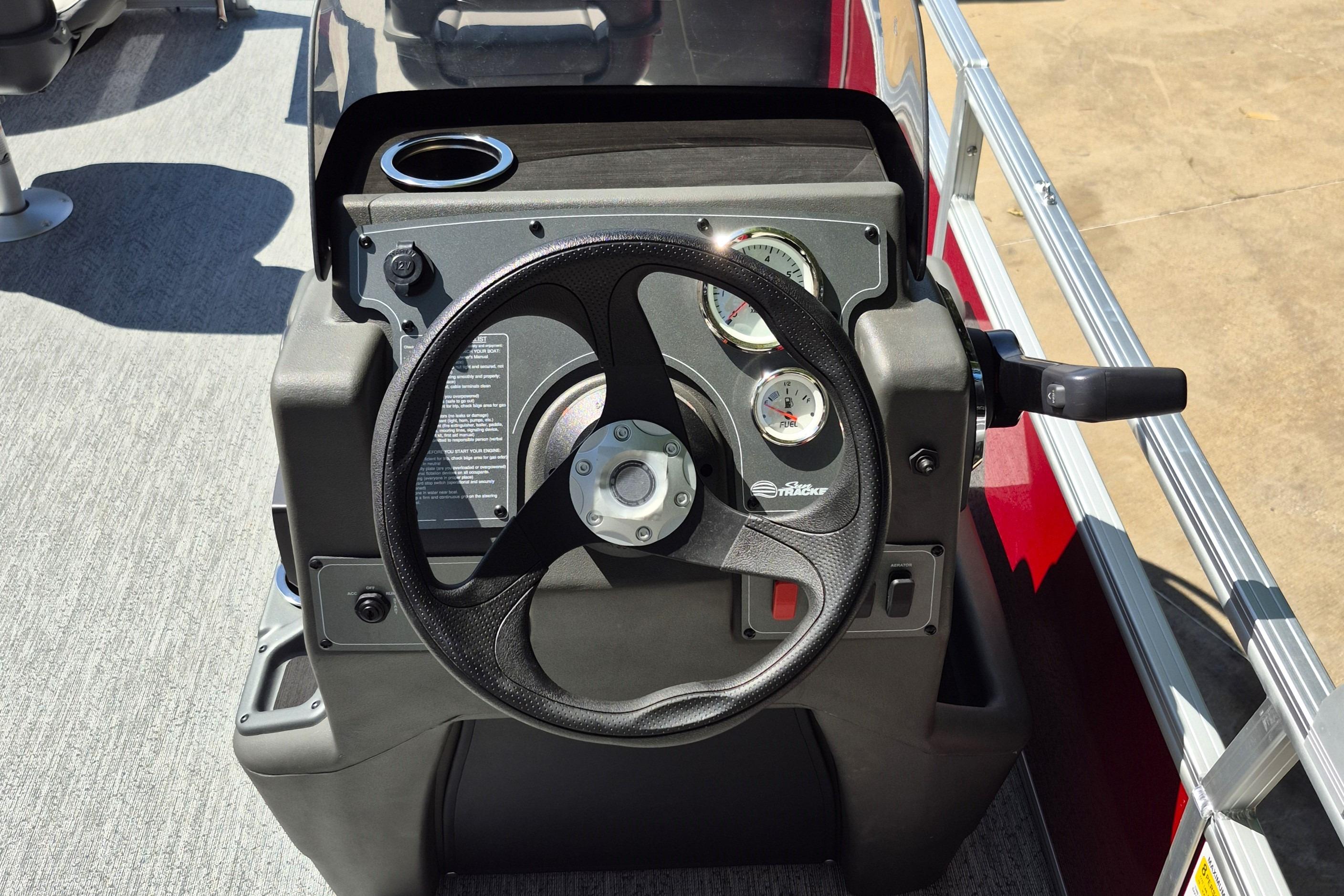 Steering console of 2026 Sun Tracker Bass Buggy 18 DLX pontoon boat.