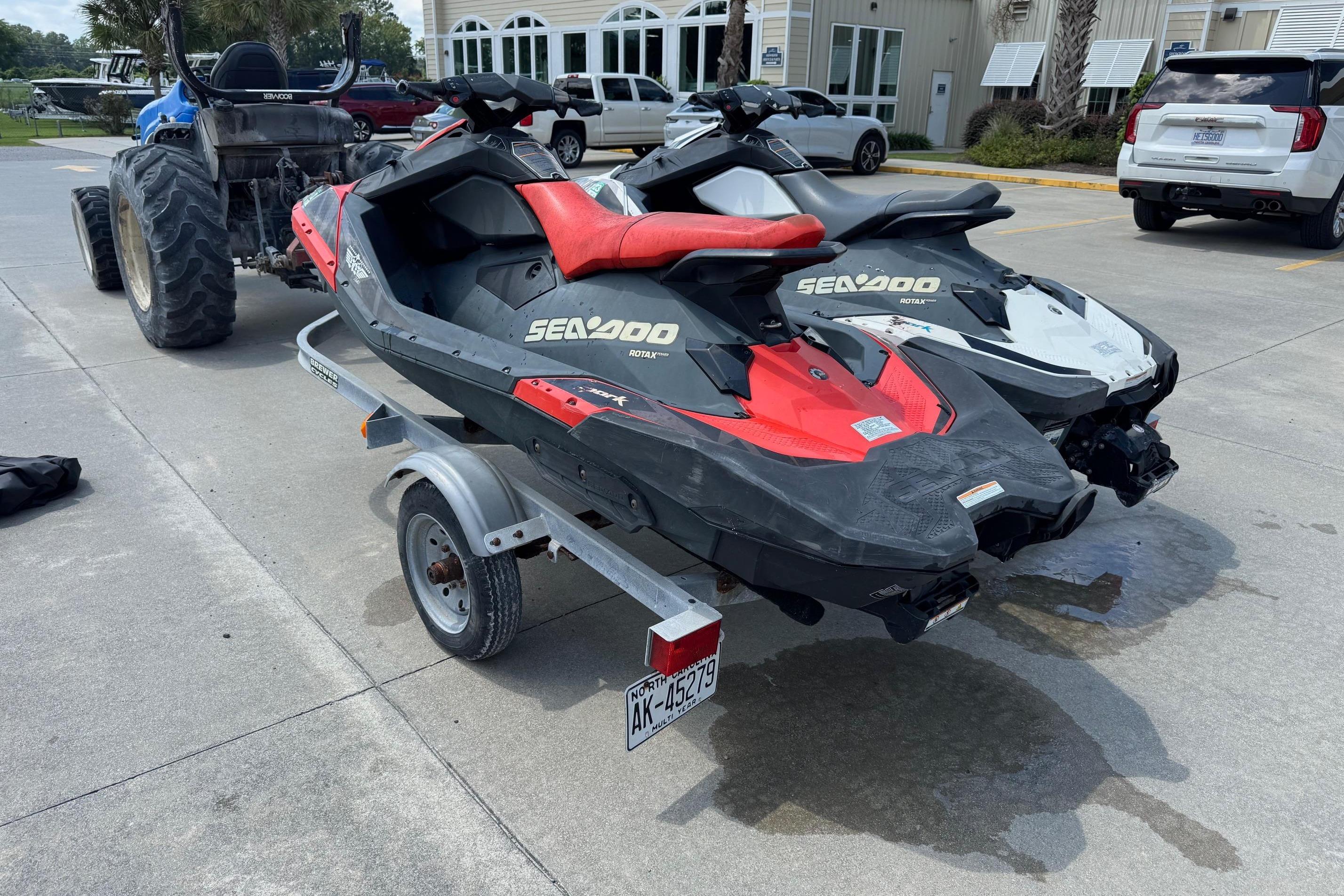 2017 Sea-Doo Spark 2up jet skis on trailer, parked outdoors.