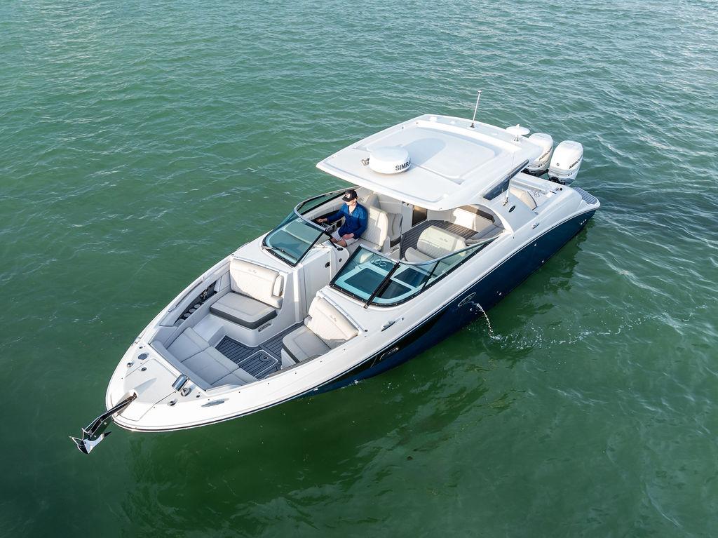 2021 Sea Ray 350 SLX OB luxury boat cruising on calm waters.