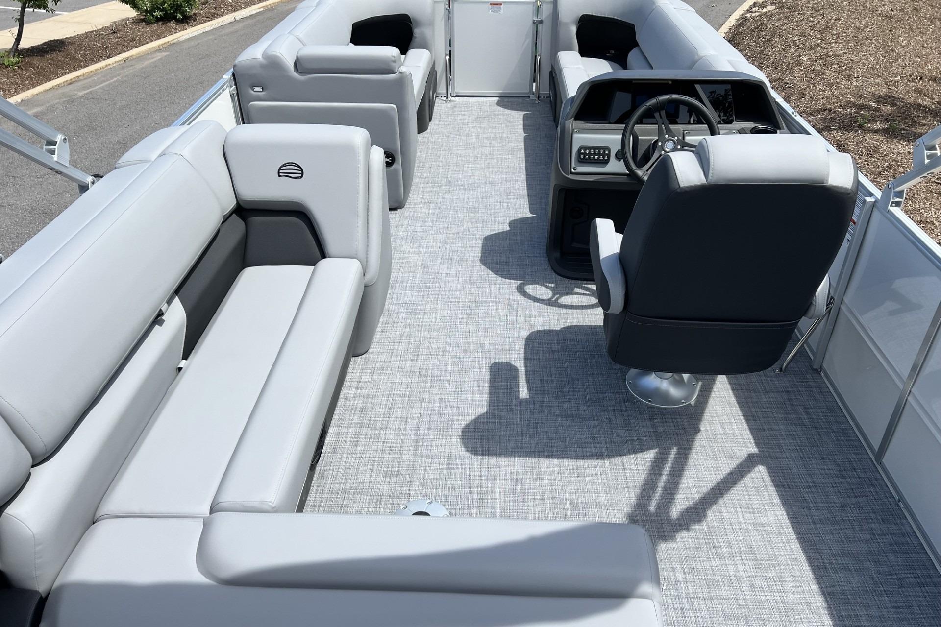 2026 Sun Tracker Party Barge 20 DLX interior with spacious seating and modern helm.