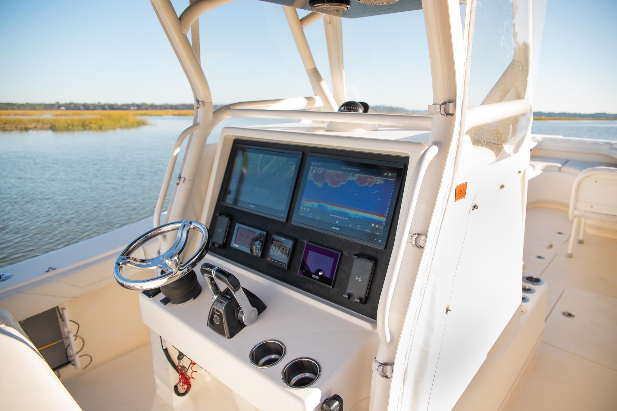 2014 Yellowfin 34 Offshore boat console with advanced navigation system on calm water.