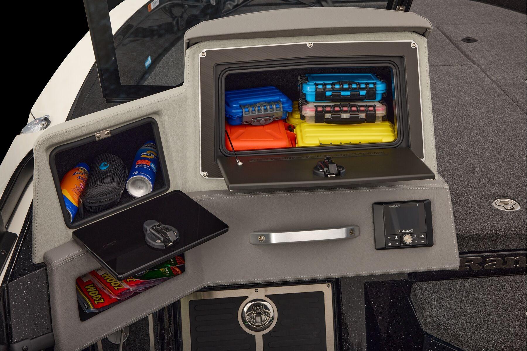 Manufacturer Provided Image: 2026 Ranger 620xFS Pro boat storage compartments with colorful gear and audio controls.
