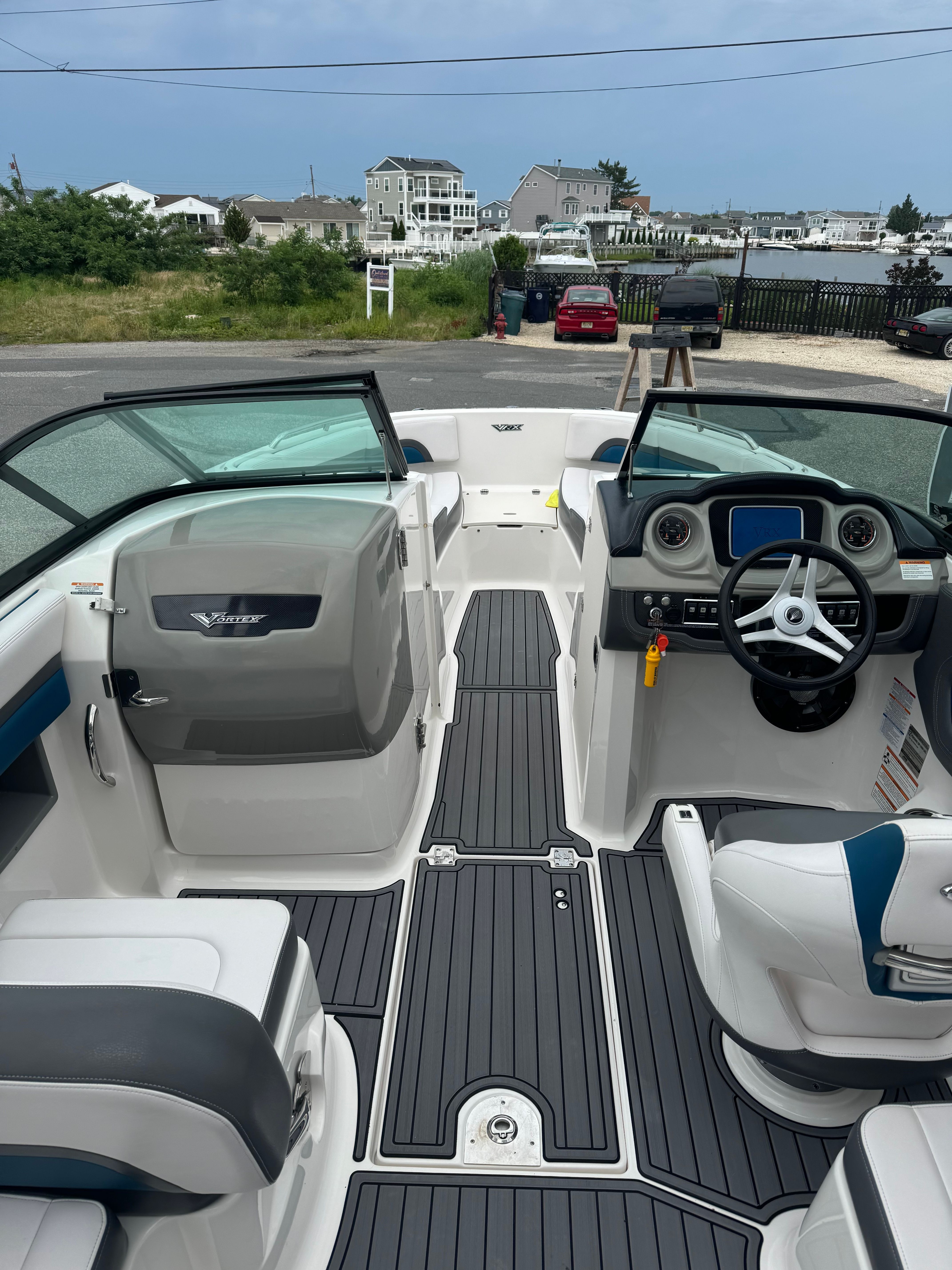 The image shows the cockpit of a 2016 Chaparral Vortex 243 VRX with modern seating and controls.