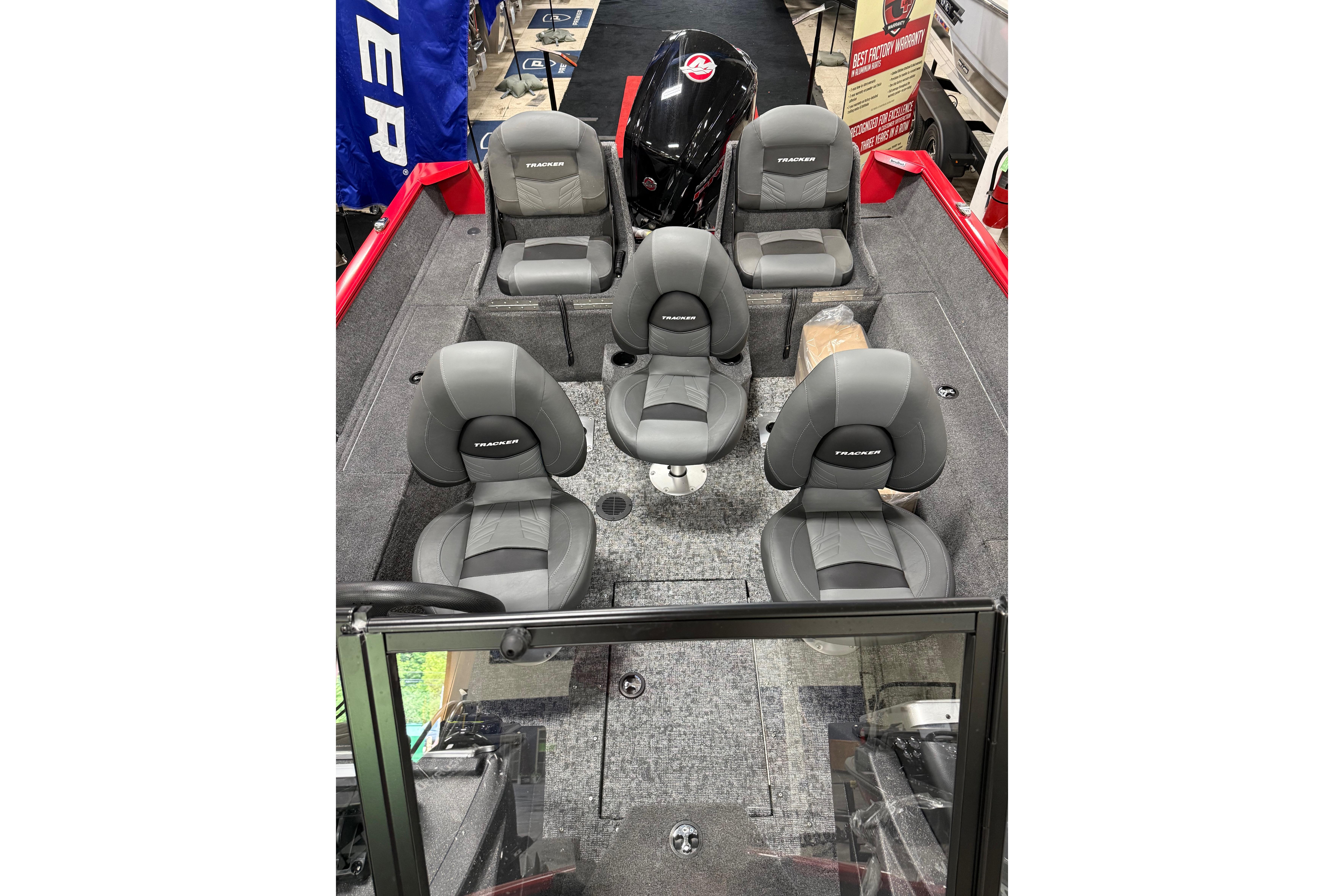 2026 Tracker Pro Guide V-175 Combo boat interior with six gray seats and carpeted flooring.