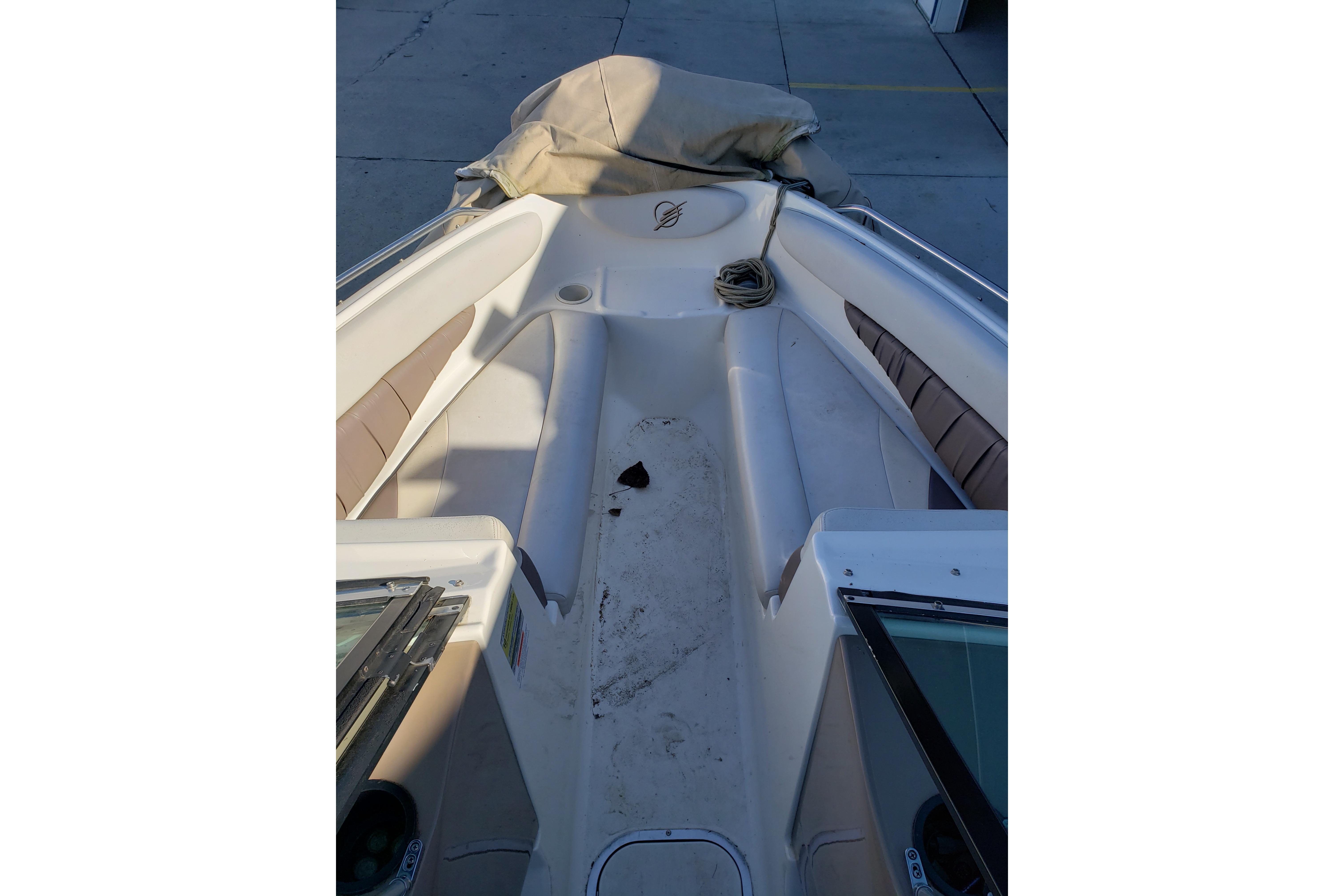 1998 Wellcraft Eclipse 2000 SS boat interior with seating and storage area.