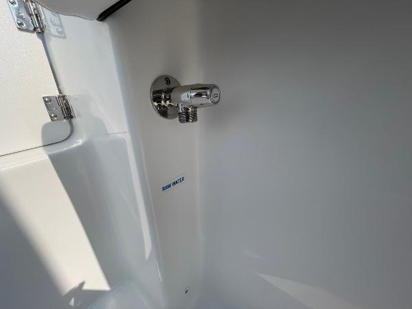 2025 Tidewater 232 CC Adventure boat raw water faucet detail.