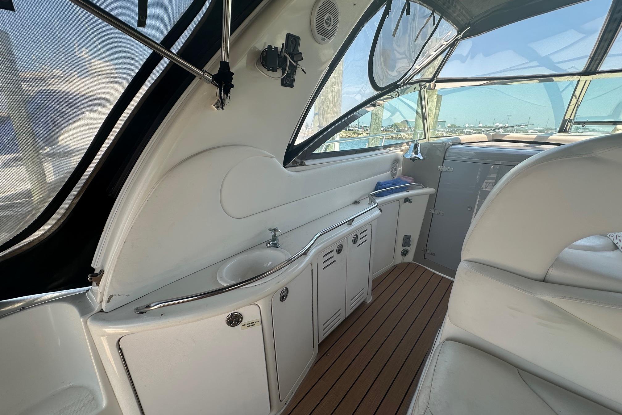 Interior of 2001 Sea Ray 410 Sundancer yacht with sleek design and wooden flooring.