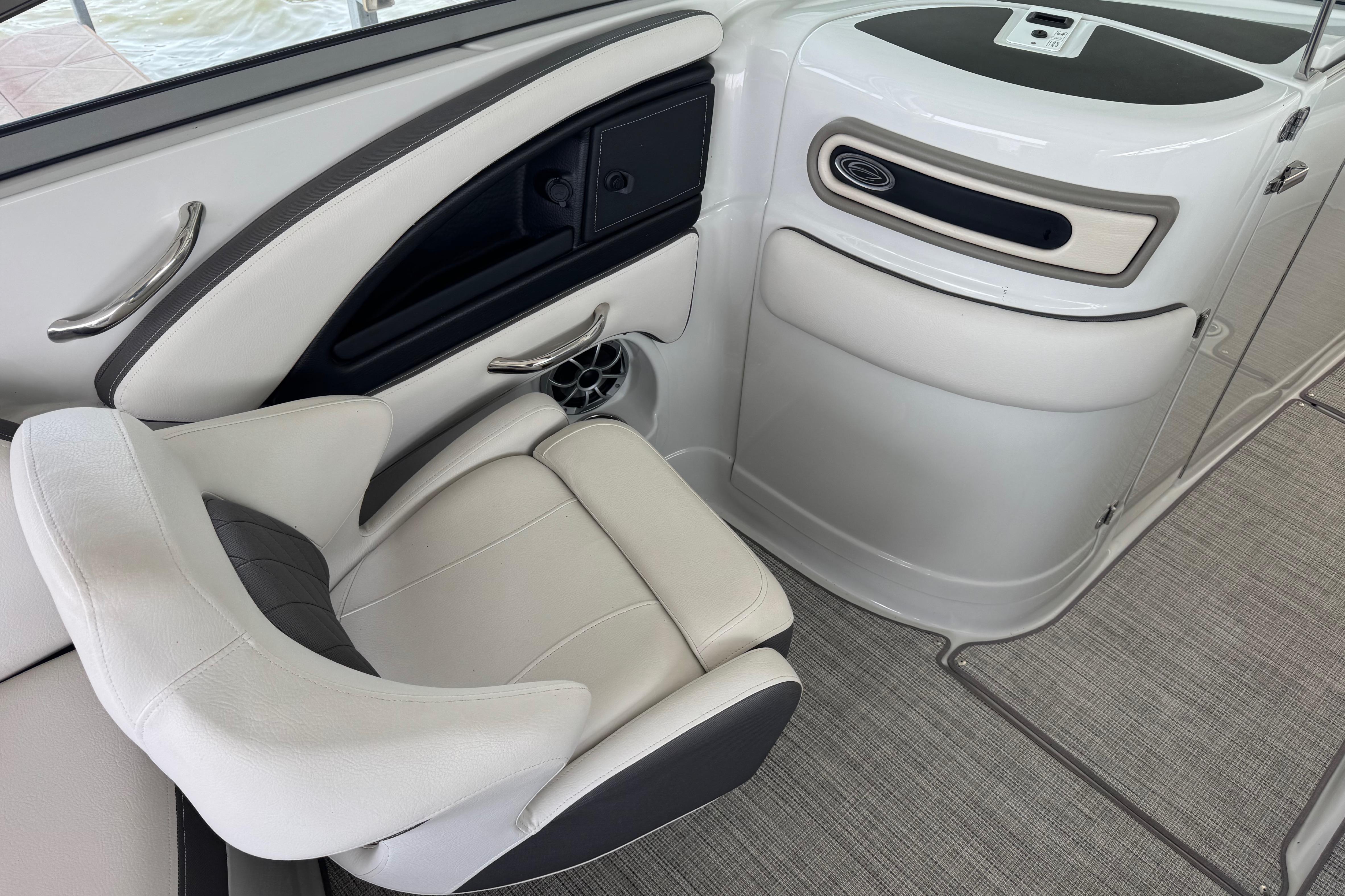 Interior of 2022 Crownline 265 SS boat, featuring sleek seating and modern design elements.