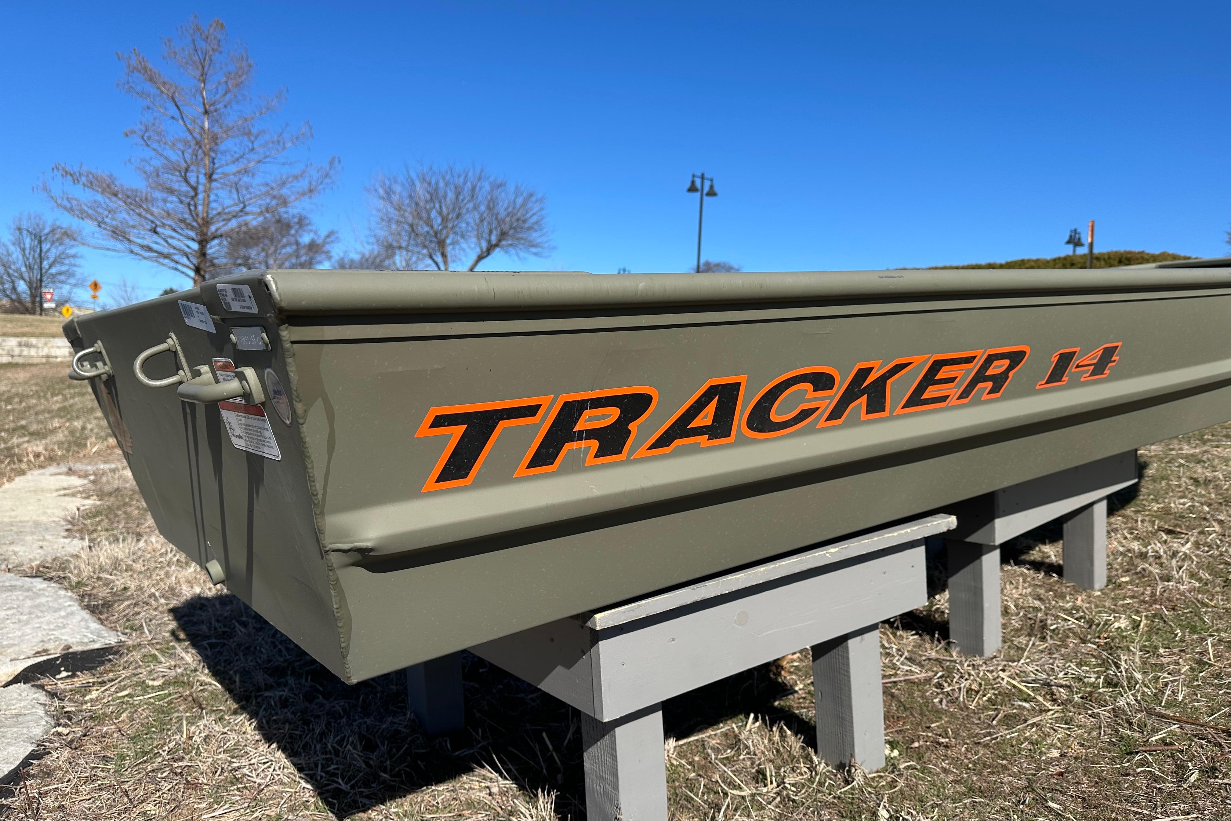 2026 Tracker Grizzly 14 Jon boat displayed outdoors on a sunny day.