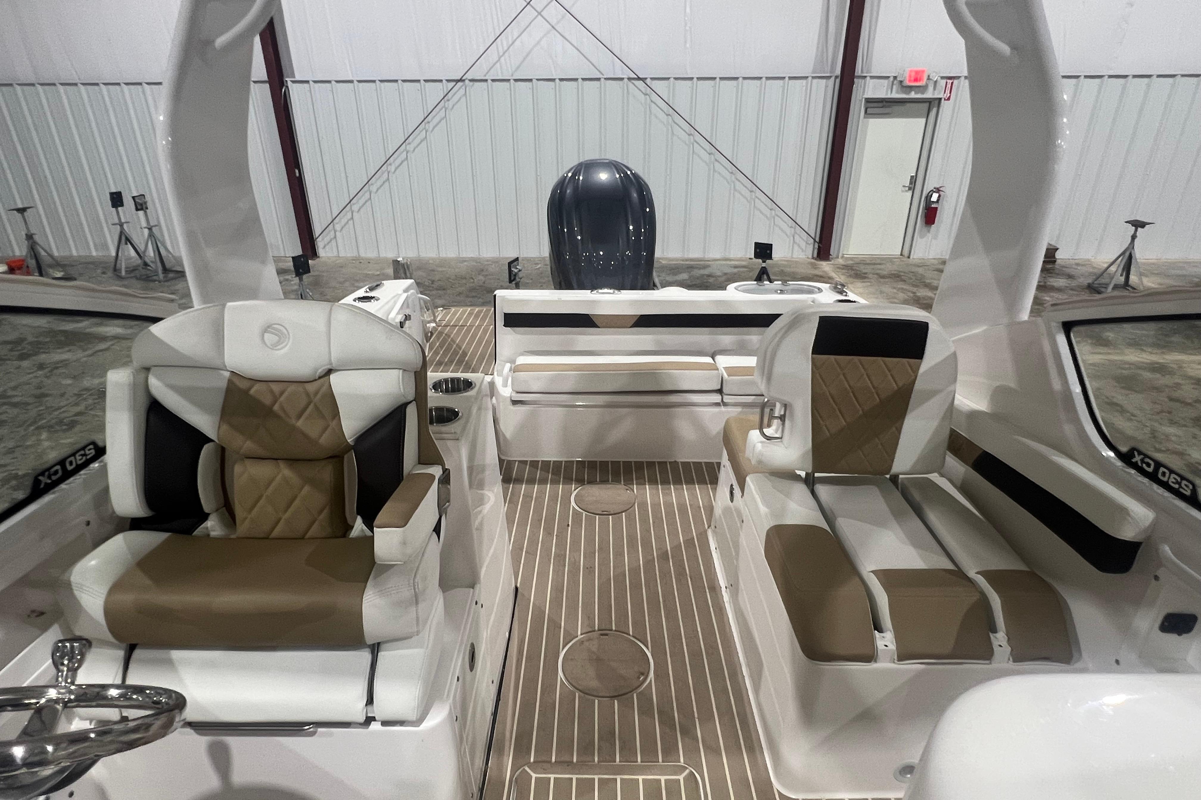 2023 Edgewater 230CX Crossover boat interior with stylish seating and modern design.
