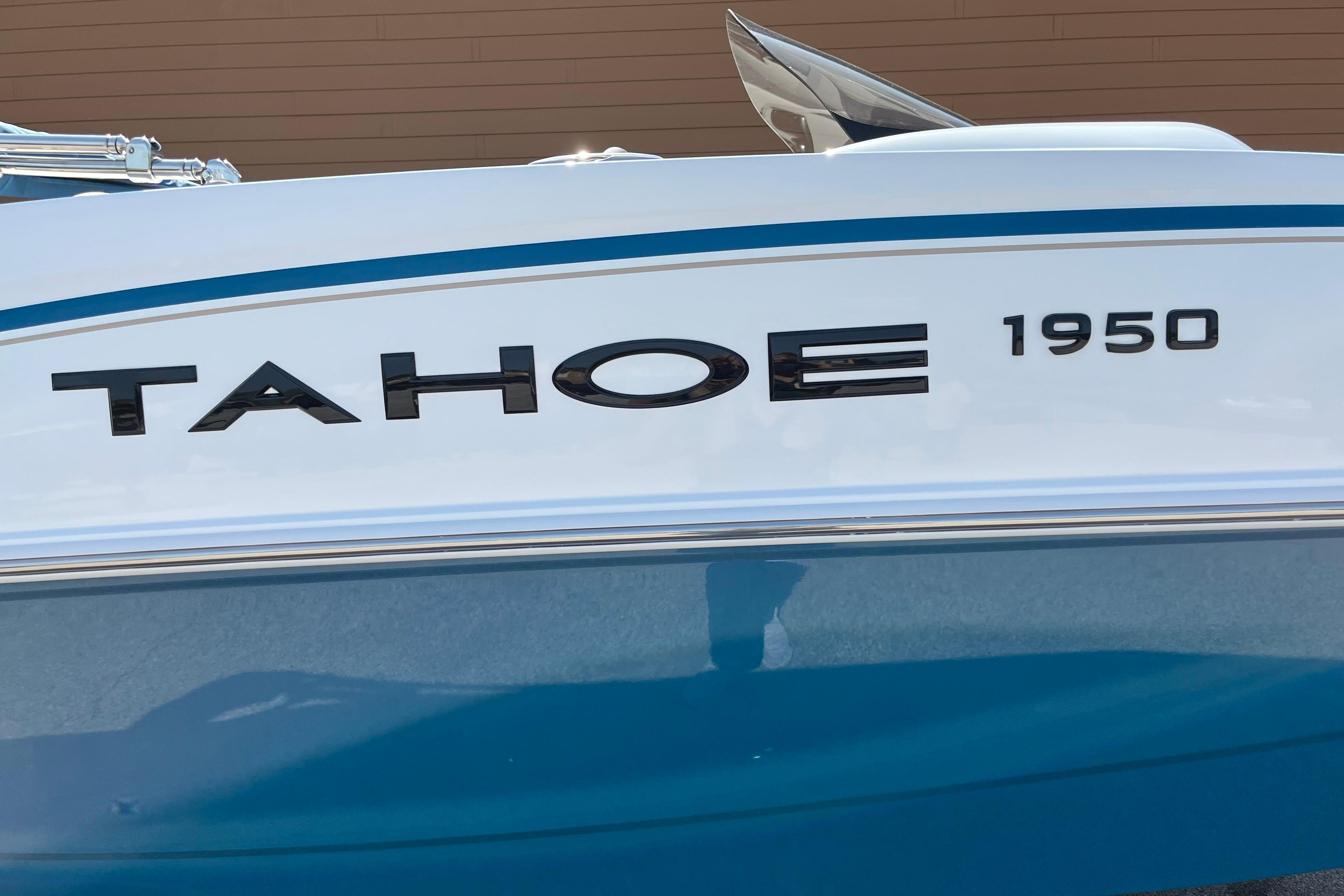 2026 Tahoe 1950 boat with sleek blue and white design.