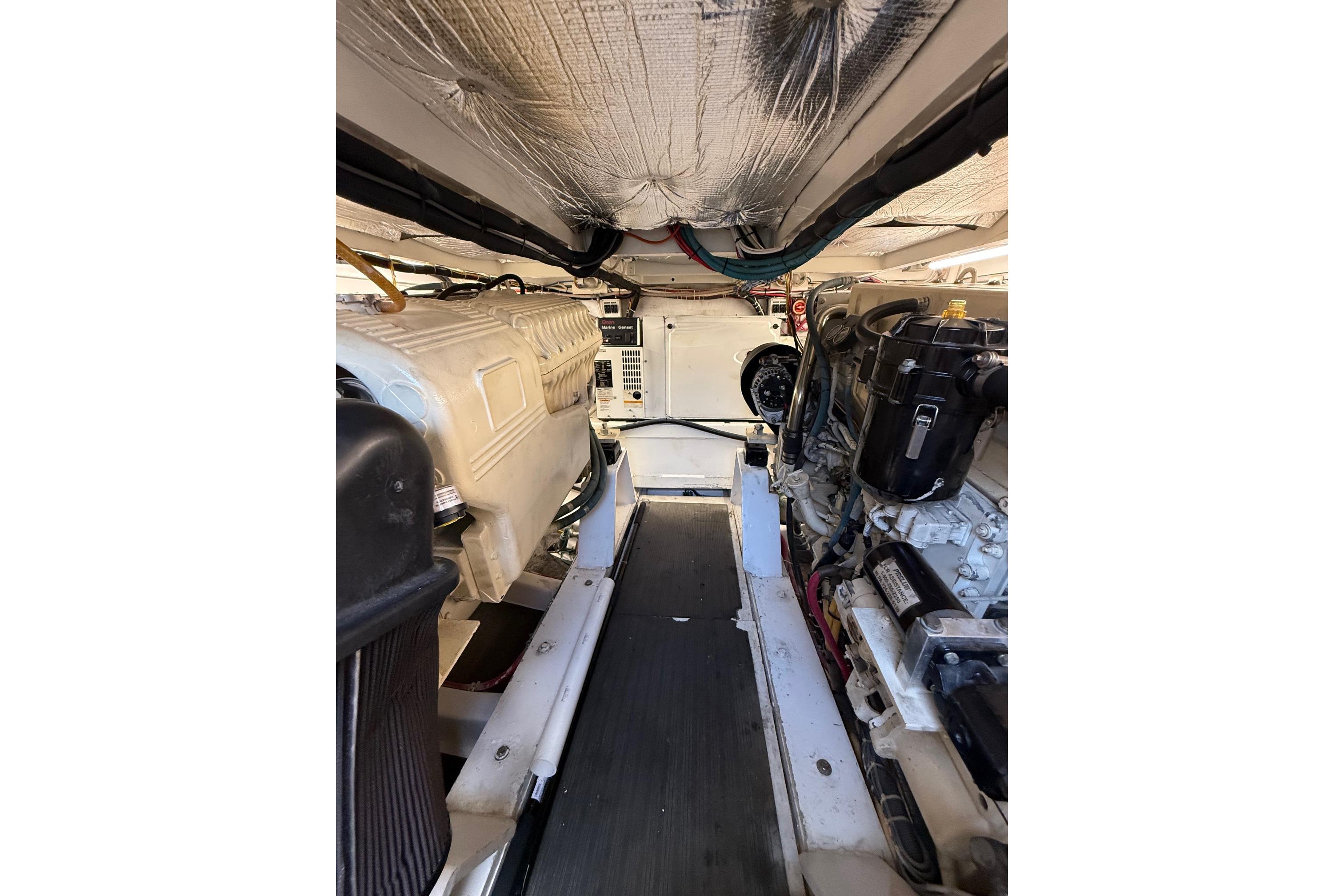 Engine room of 2006 Custom Carolina Heritage Express boat, showcasing mechanical components.