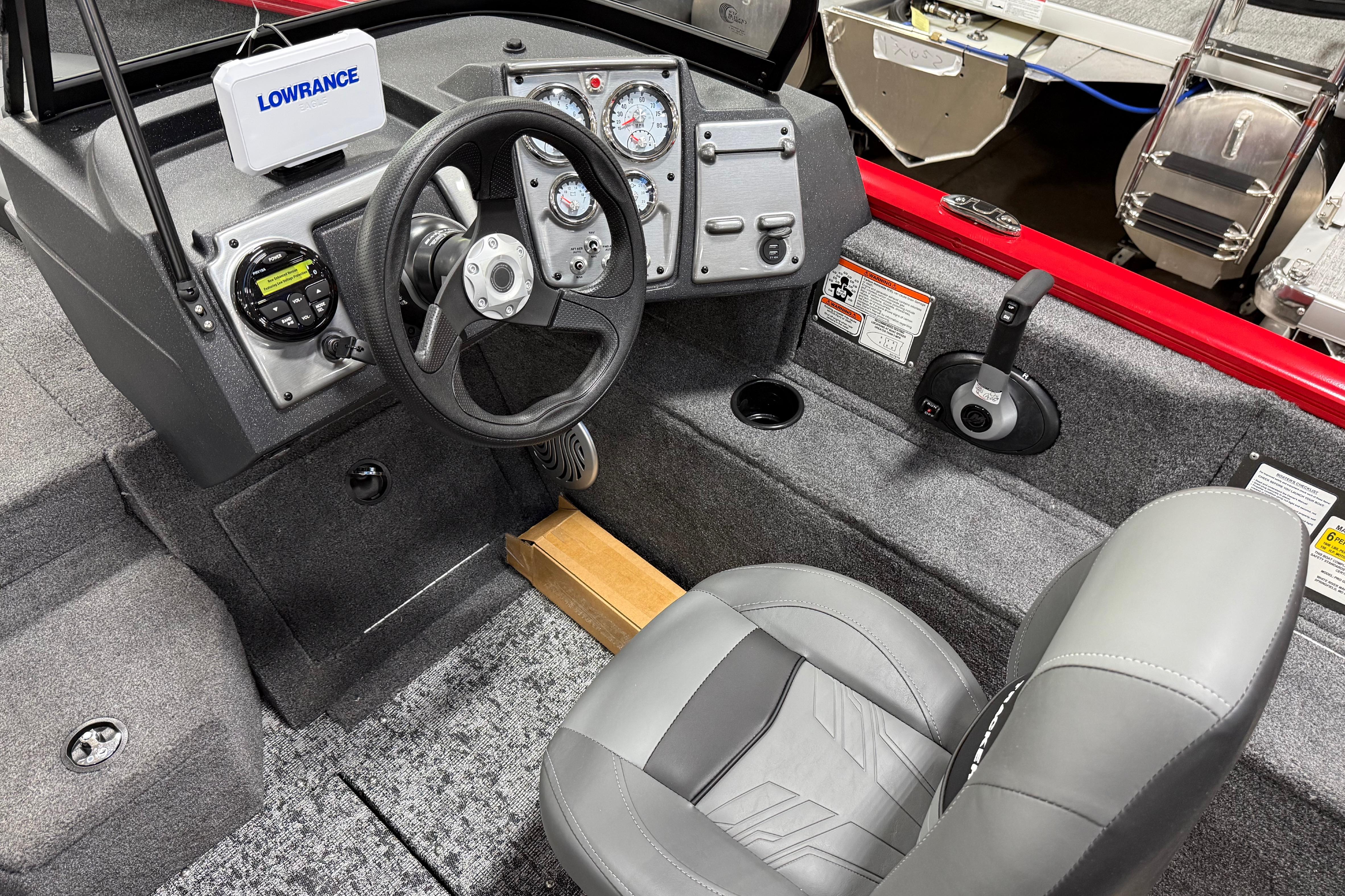 2026 Tracker Pro Guide V-175 Combo boat interior with steering wheel and control panel.