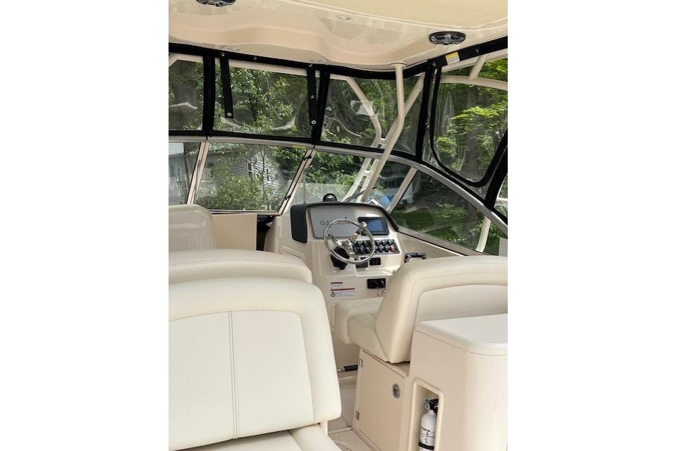 2022 Grady-White Freedom 255 boat interior with steering wheel and seating.