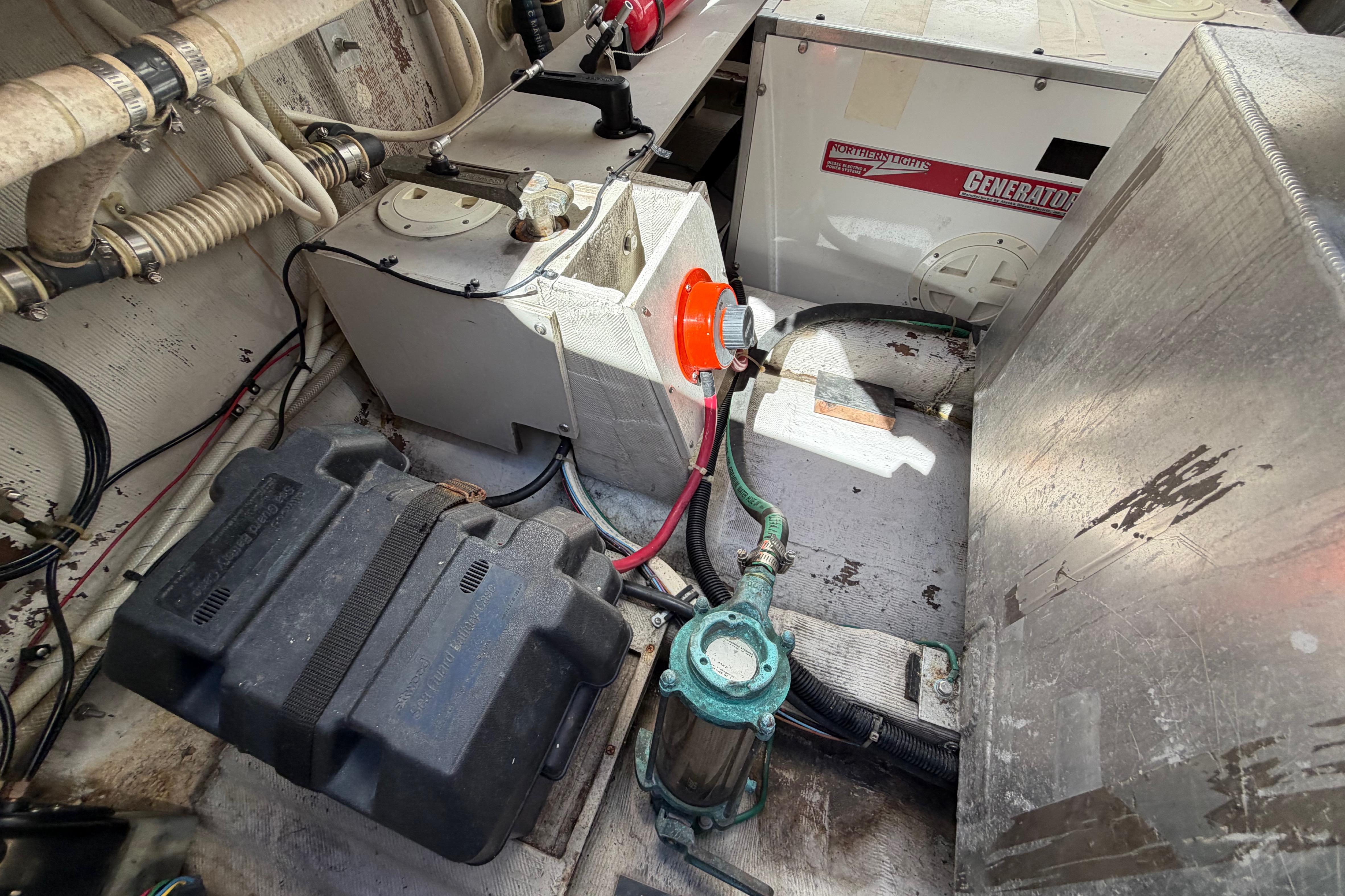 Engine compartment of 2000 Sabreline 36 Express with generator and battery setup.