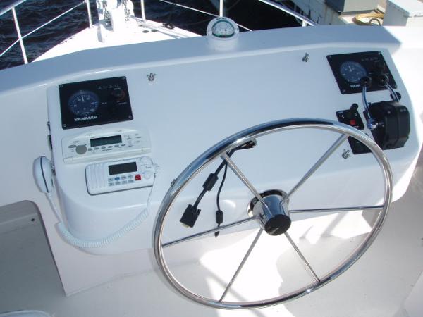 Steering console of 2025 Great Harbour N40 boat with navigation instruments and controls.