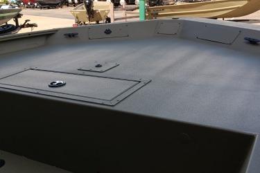 2026 Tracker Grizzly 1860 CC boat deck, featuring storage compartments and durable construction.