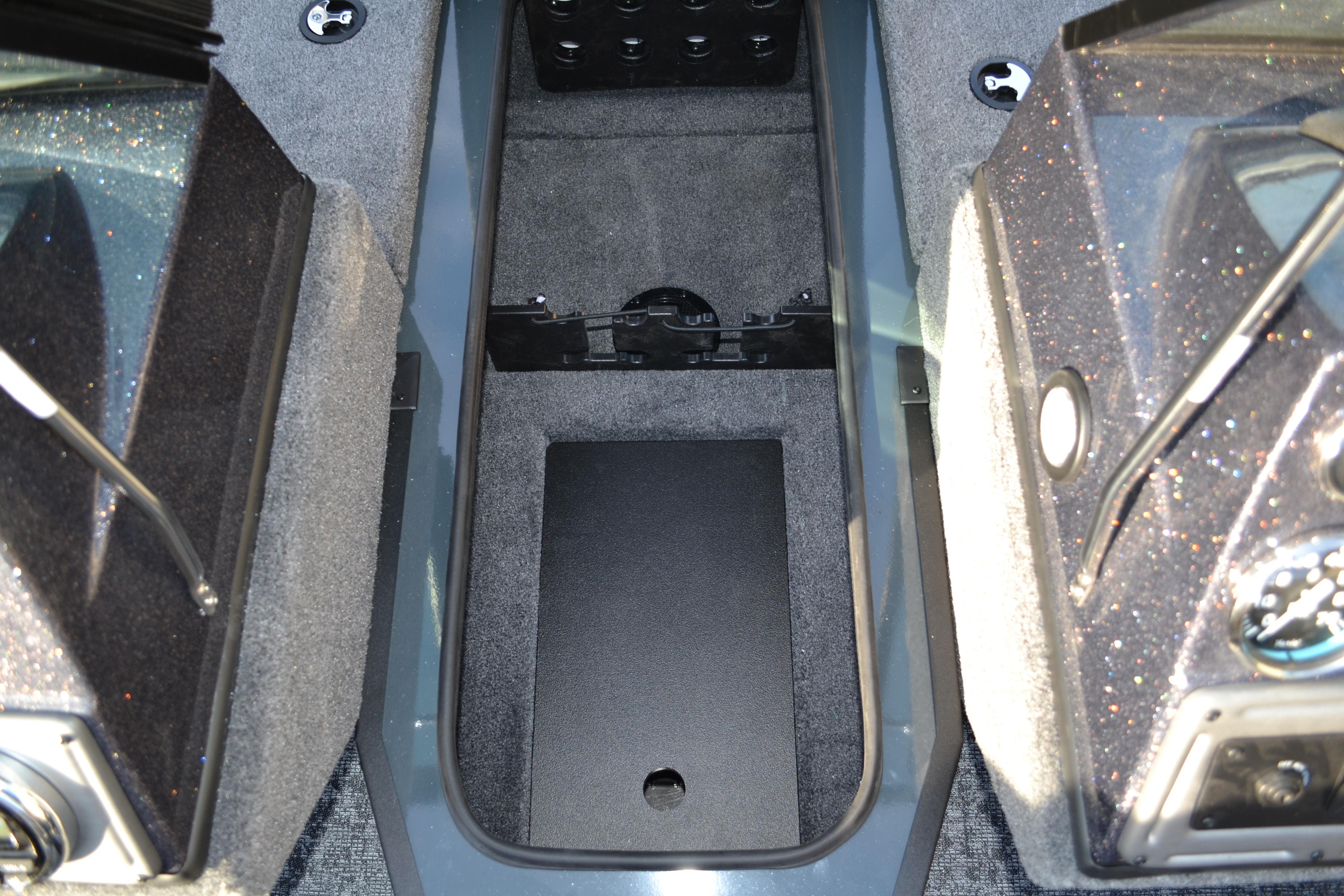 2026 Ranger VS1882SC Reata boat interior storage compartment, featuring carpeted surfaces and sleek design.