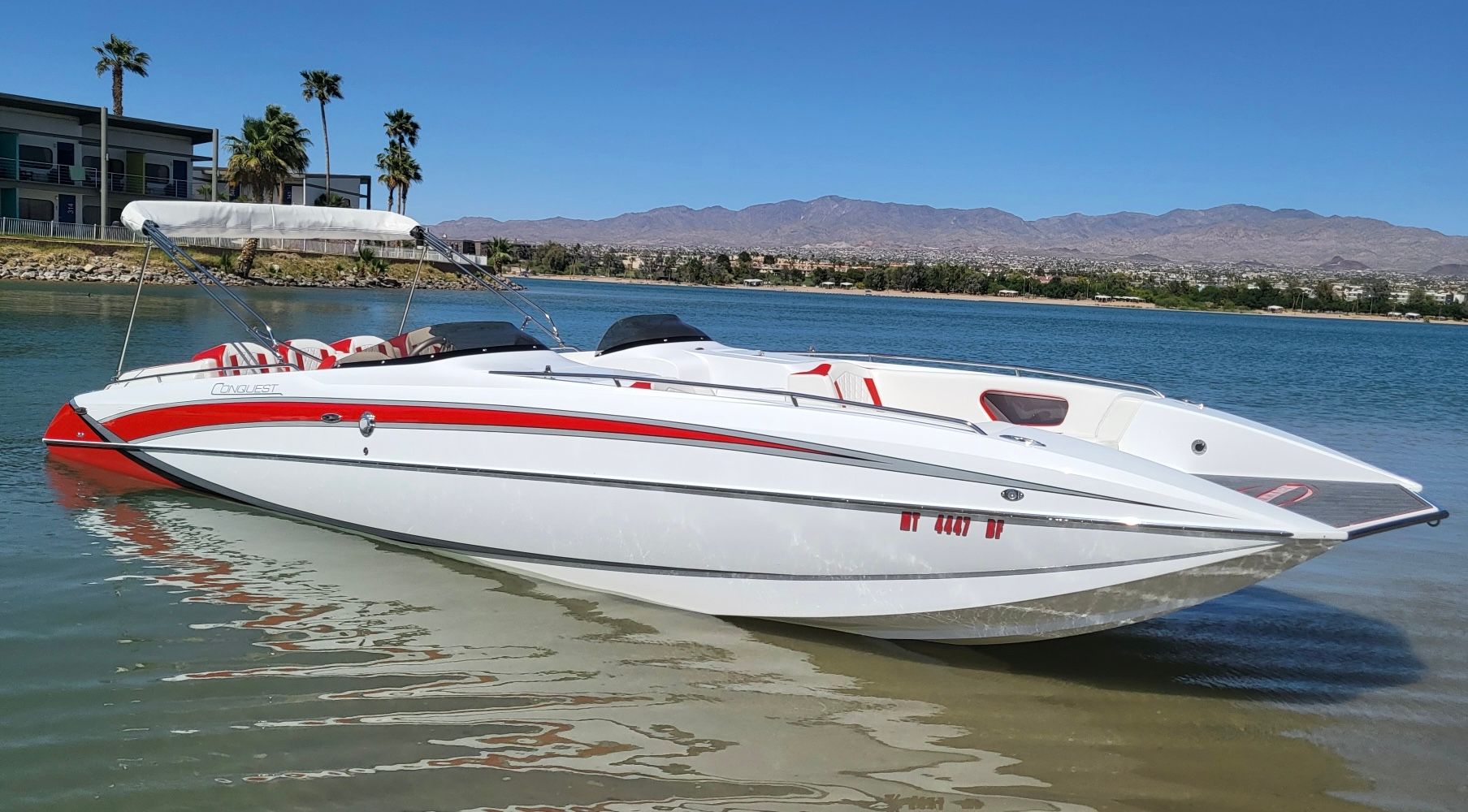 2022 Conquest 28’ Top Cat II deck boat on calm water.