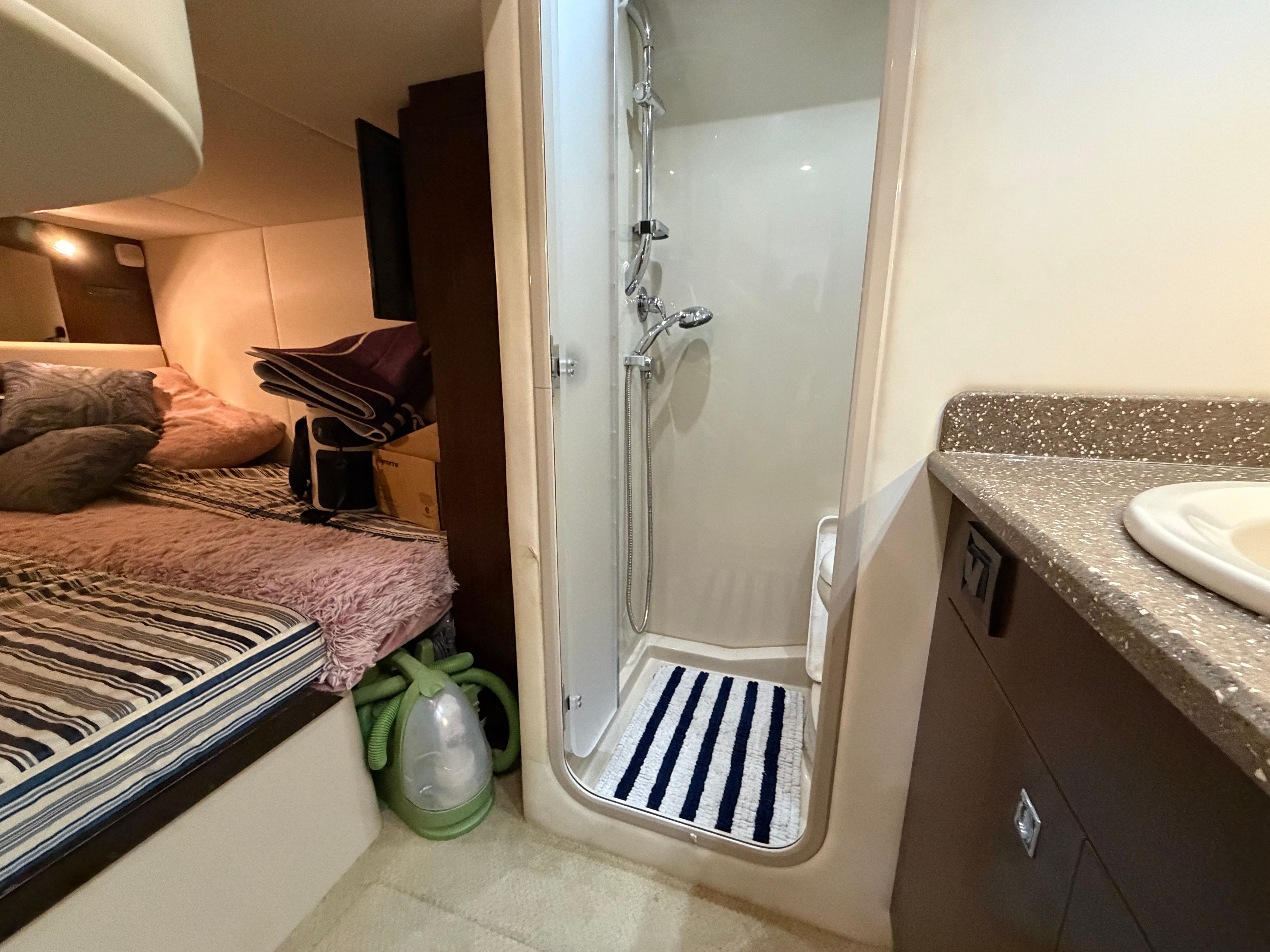 Interior of 2012 Cruisers Yachts 430 Sports Coupe with shower and bed.