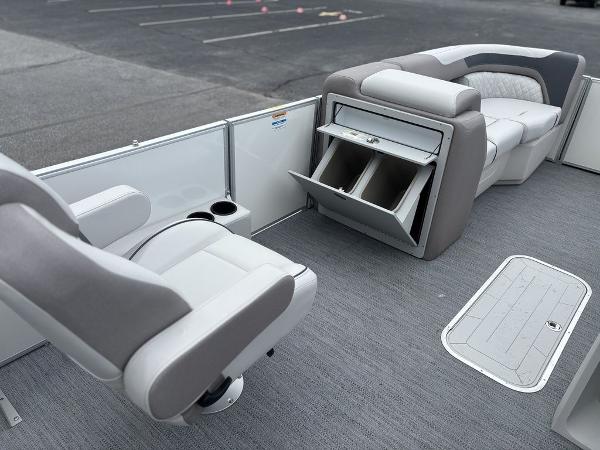 2025 Godfrey SWEETWATER 2286 SFL boat interior with seating and storage compartments.