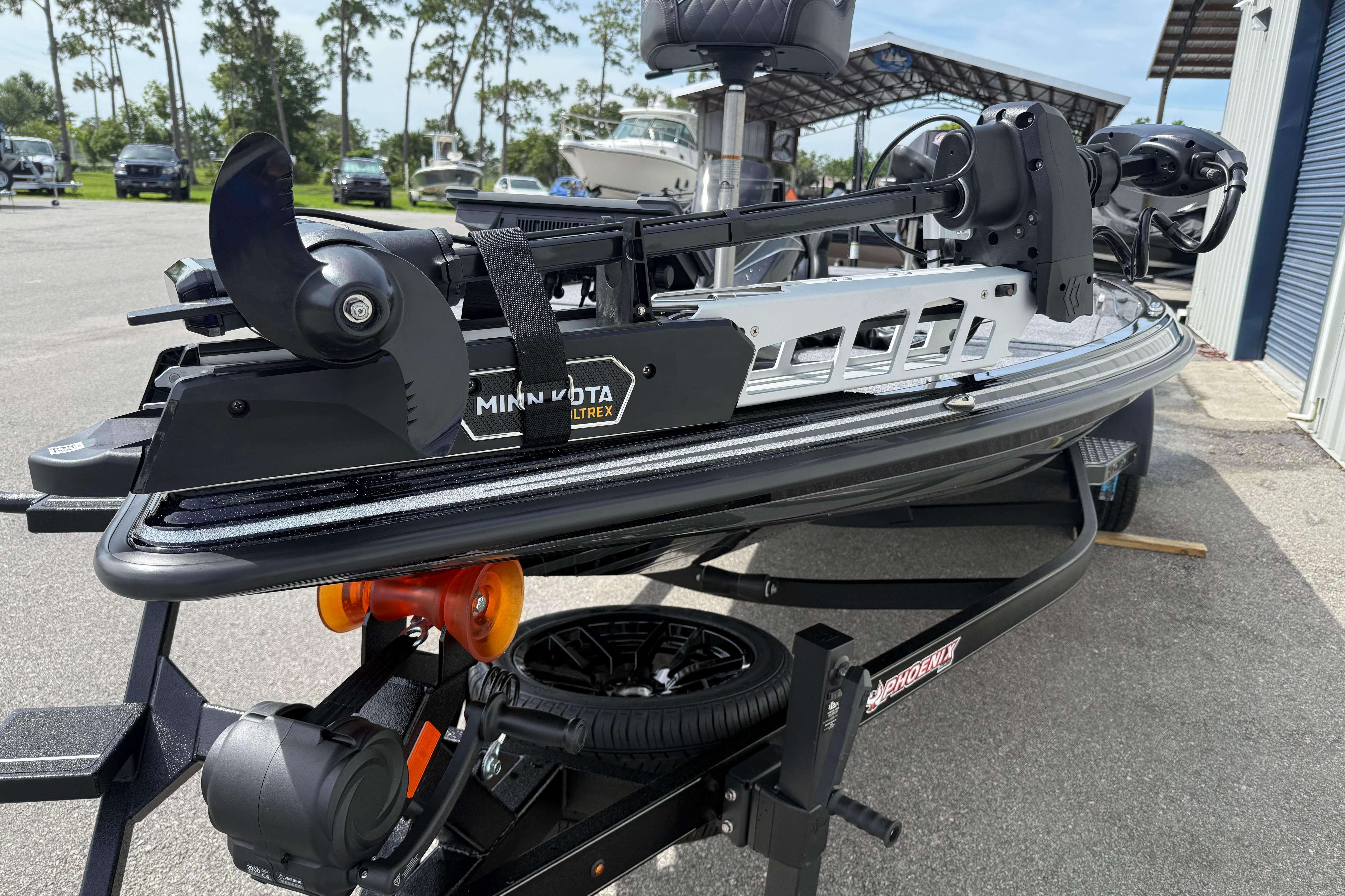 2027 Phoenix 921 Elite X boat with Minn Kota Ultrex trolling motor on trailer.