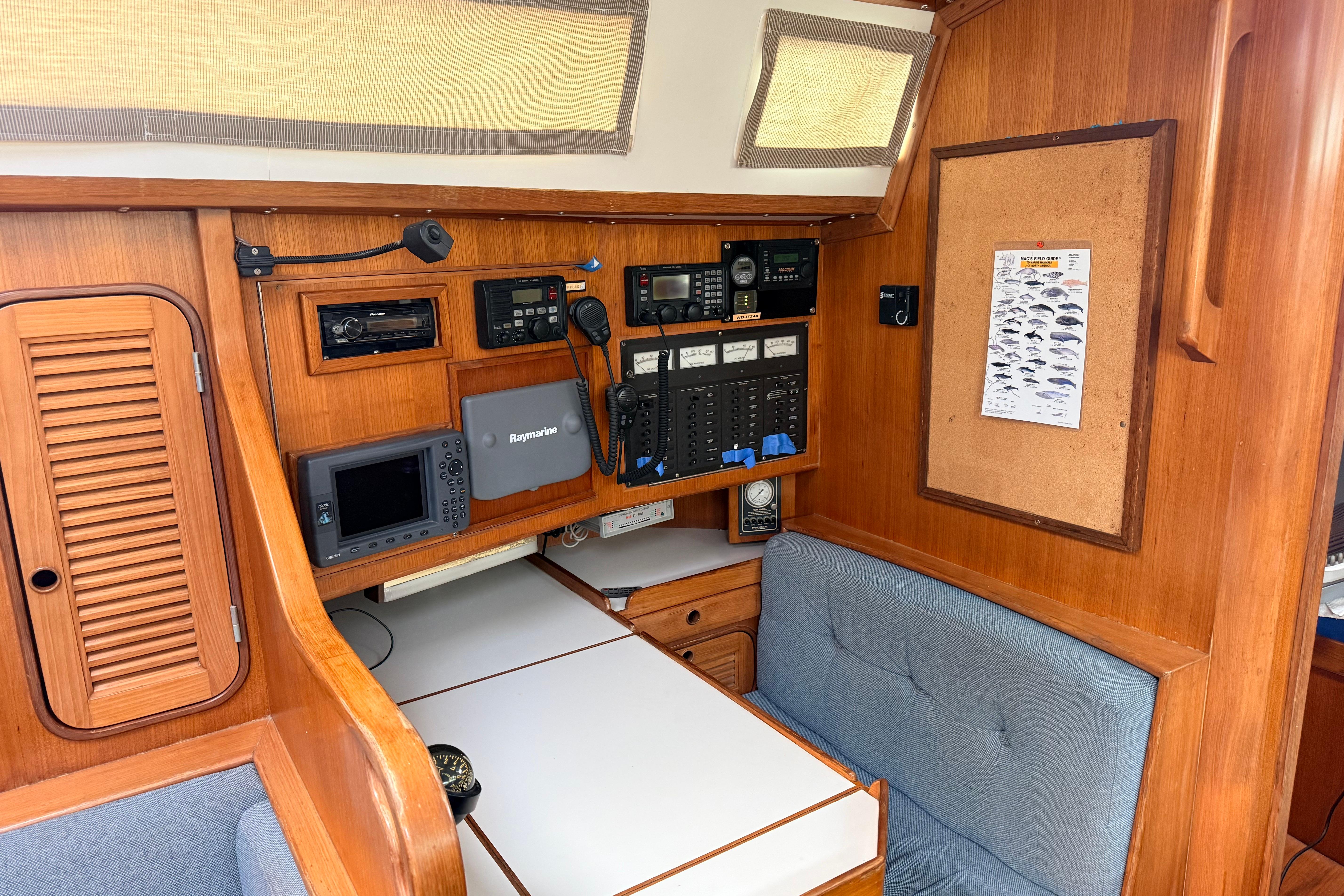 1987 Norseman 400 yacht interior with navigation equipment and wooden cabinetry.