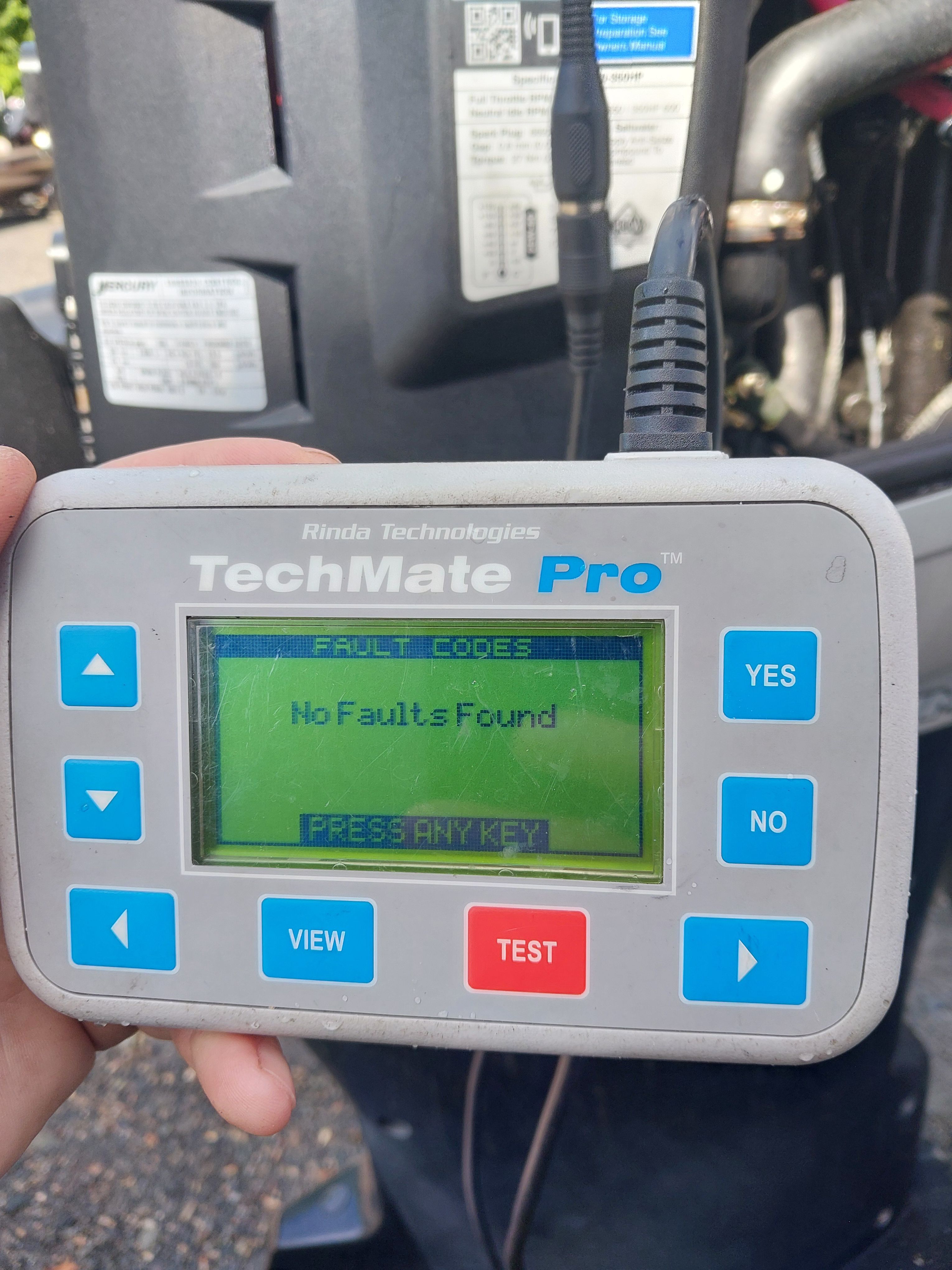 A diagnostic device displays "No Faults Found."