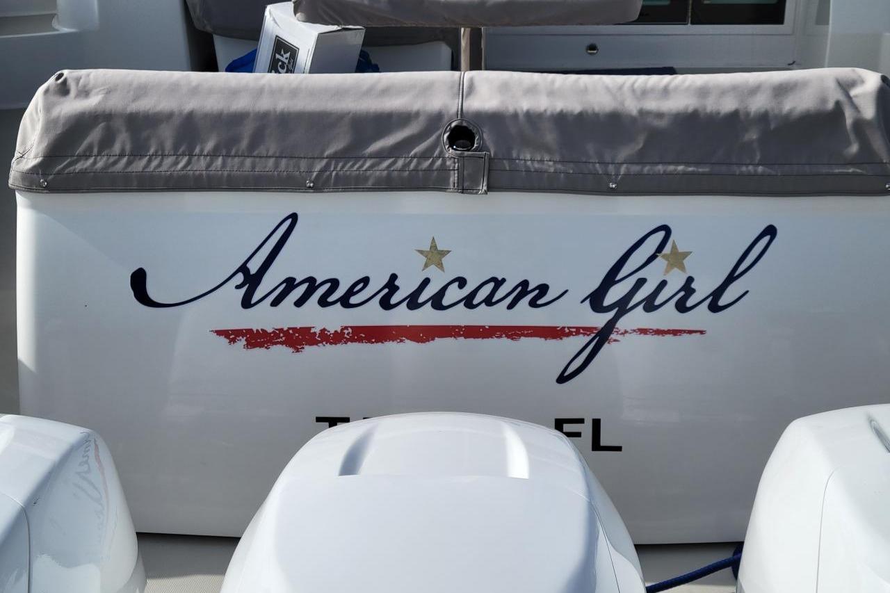 Back Cove 390 boat, 2021 model, named "American Girl" with decorative lettering.