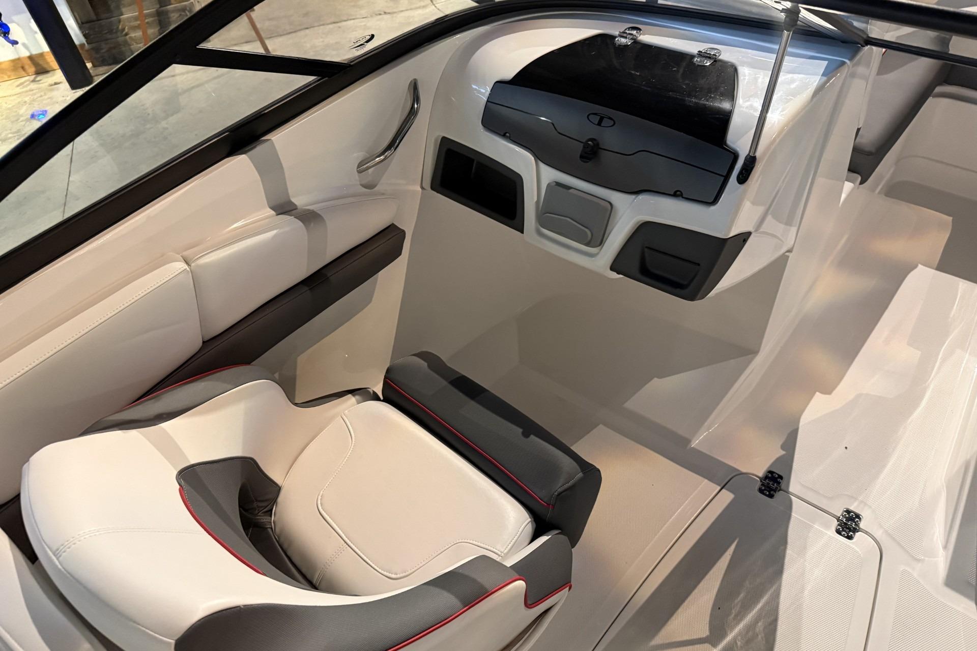 2024 Tahoe 210 S boat interior with modern seating and sleek dashboard design.
