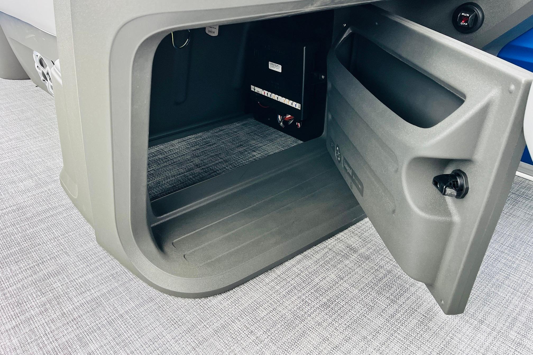 Open storage compartment on 2026 Sun Tracker Party Barge 22 RF DLX.