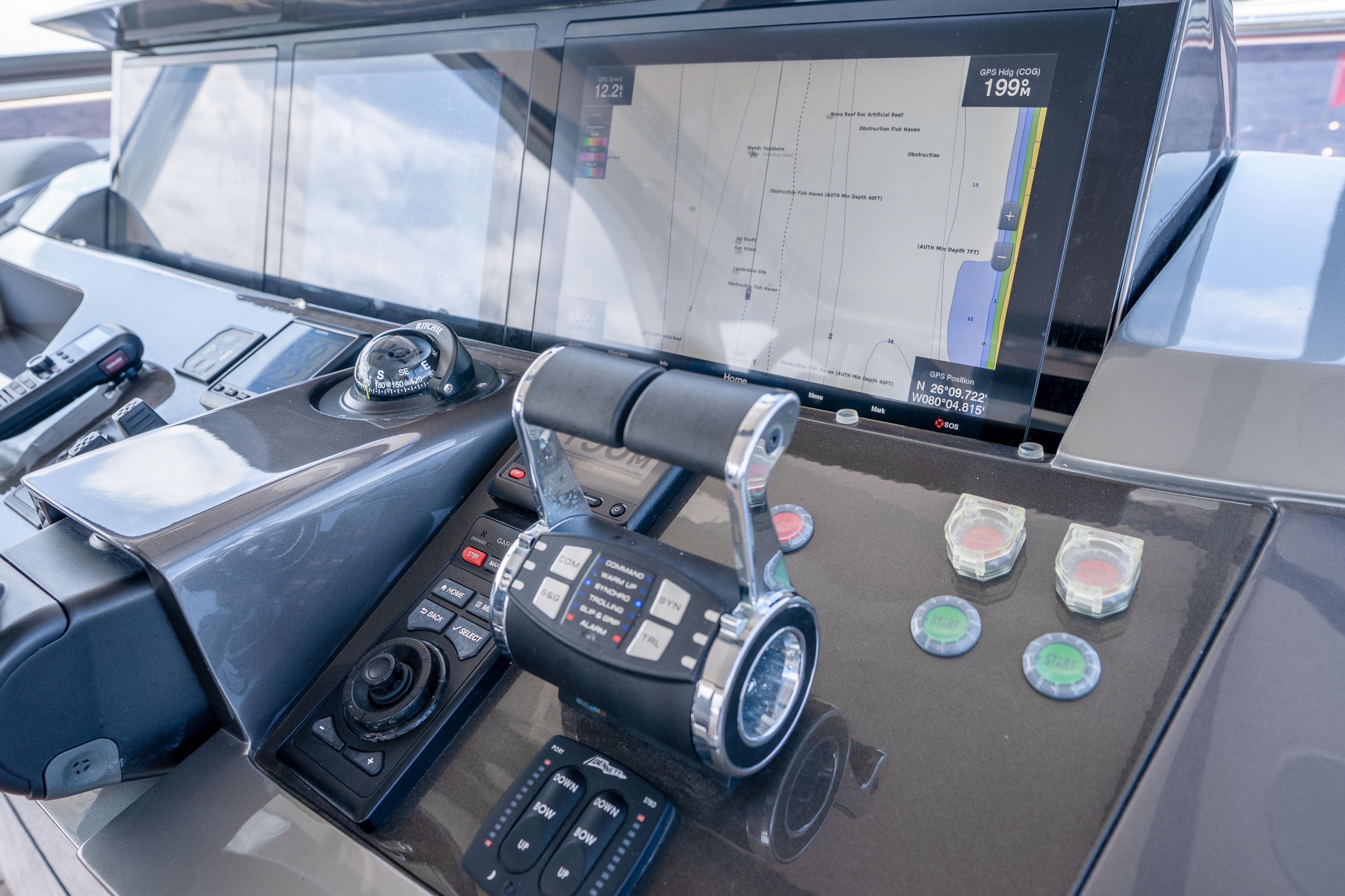 Control panel of a 2020 Princess Y85 yacht with navigation display and throttle controls.