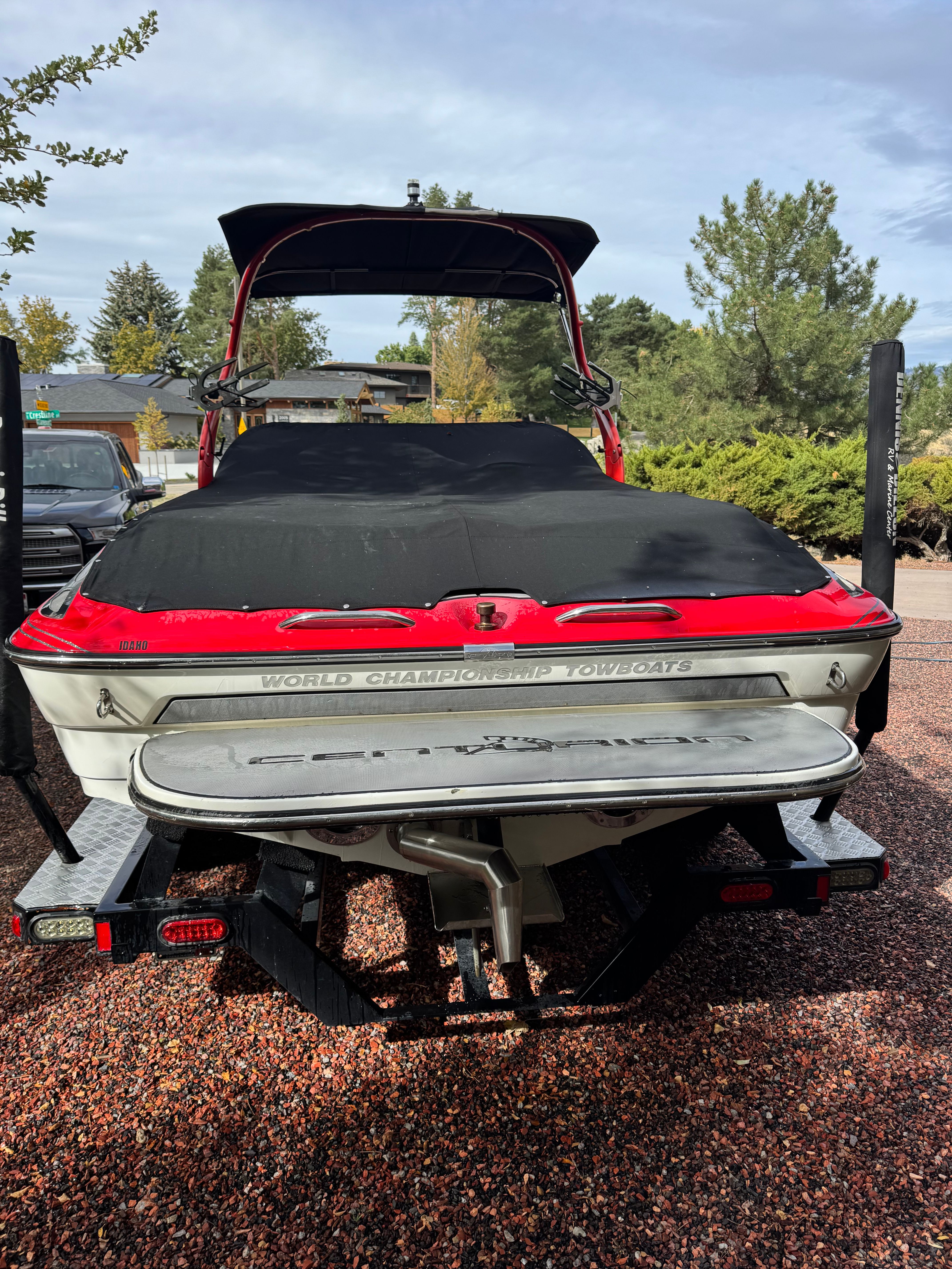A 2013 Centurion Enzo SV211 with a black cover, parked on a trailer.