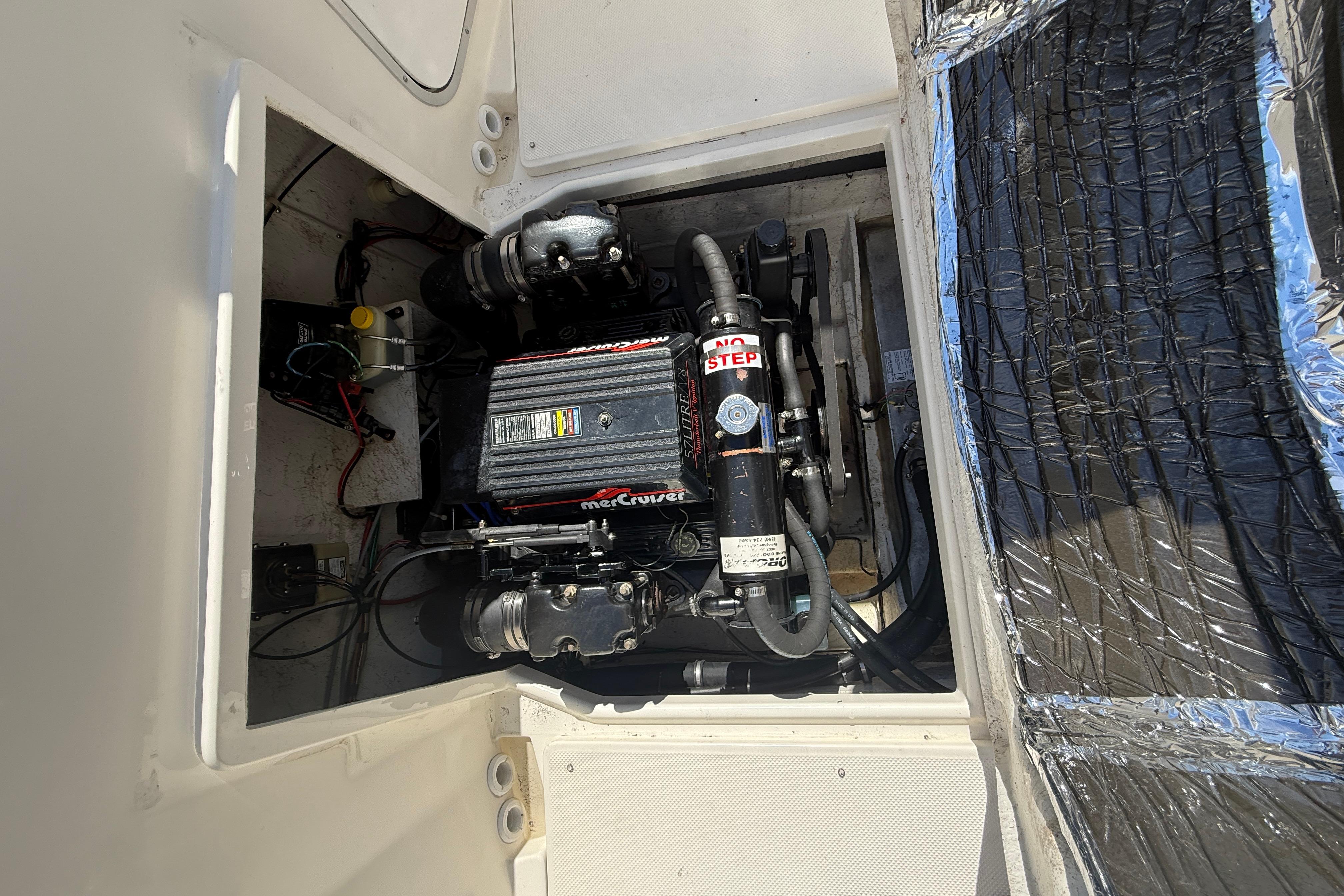 Engine compartment of a 1997 Bayliner 2452 Ciera Express with MerCruiser engine.