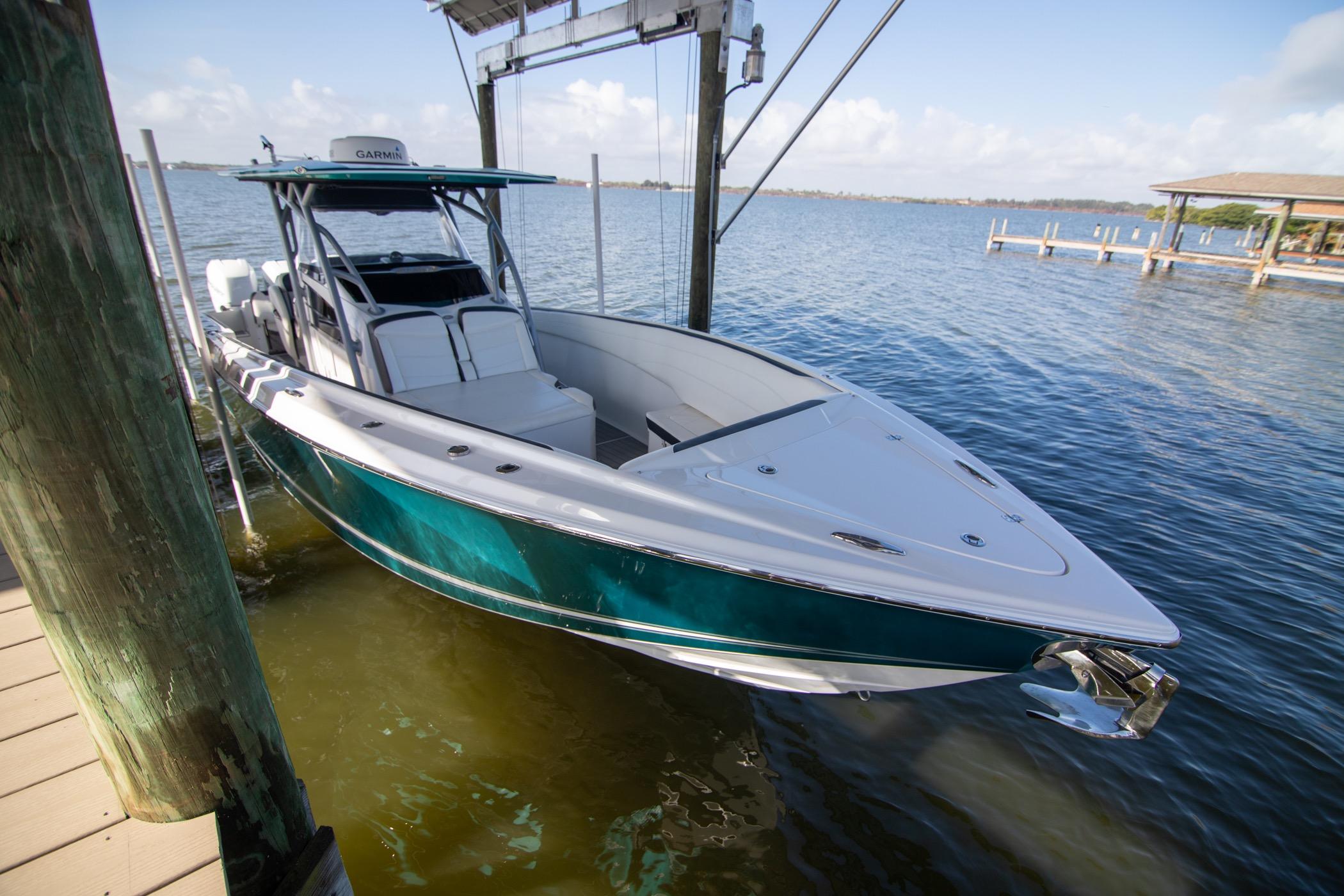 2018 Nor-Tech 340 Sport Center Console boat docked by the water.