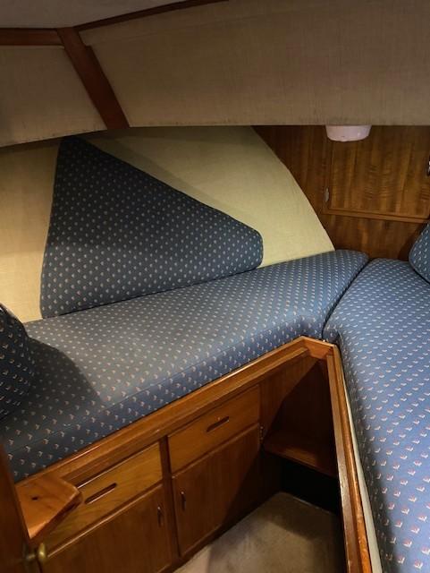 Interior cabin of 1972 DeFever 38 Passagemaker with blue patterned upholstery.