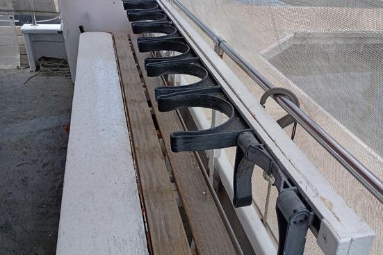 Rod holders on a 1980 Thompson Passenger and Dive Trawler deck.