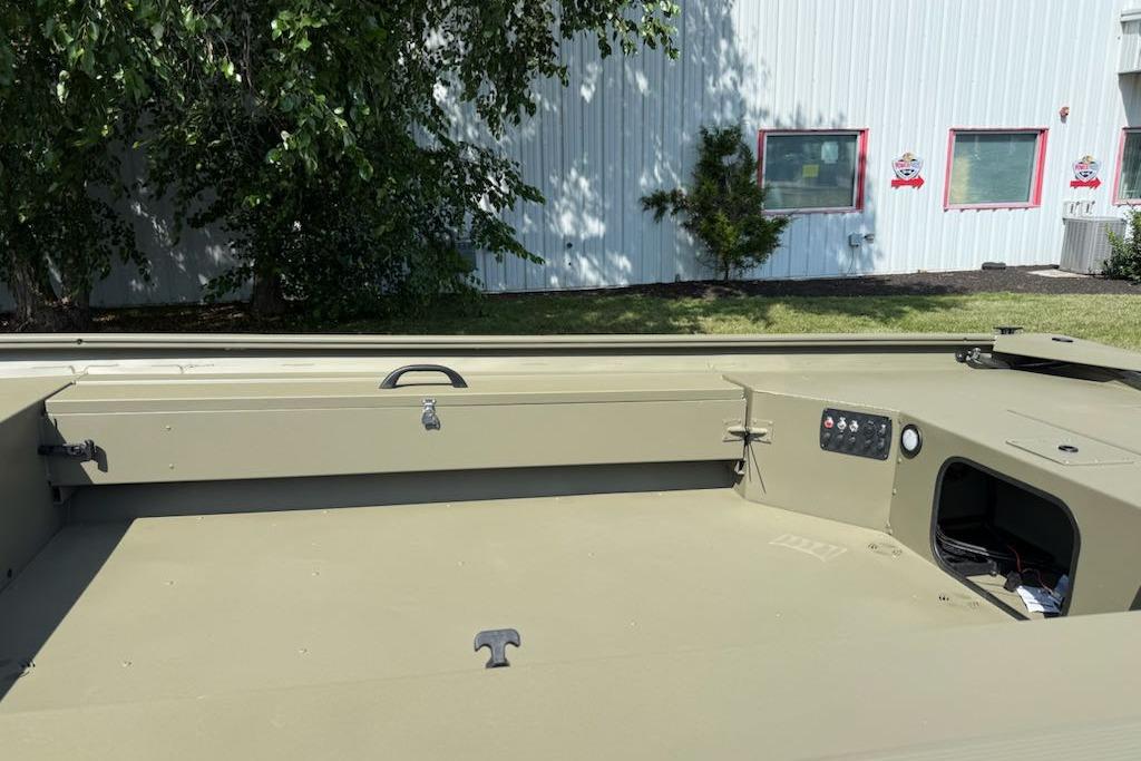 2026 Tracker Grizzly 1654 T Sportsman boat interior with control panel and storage.