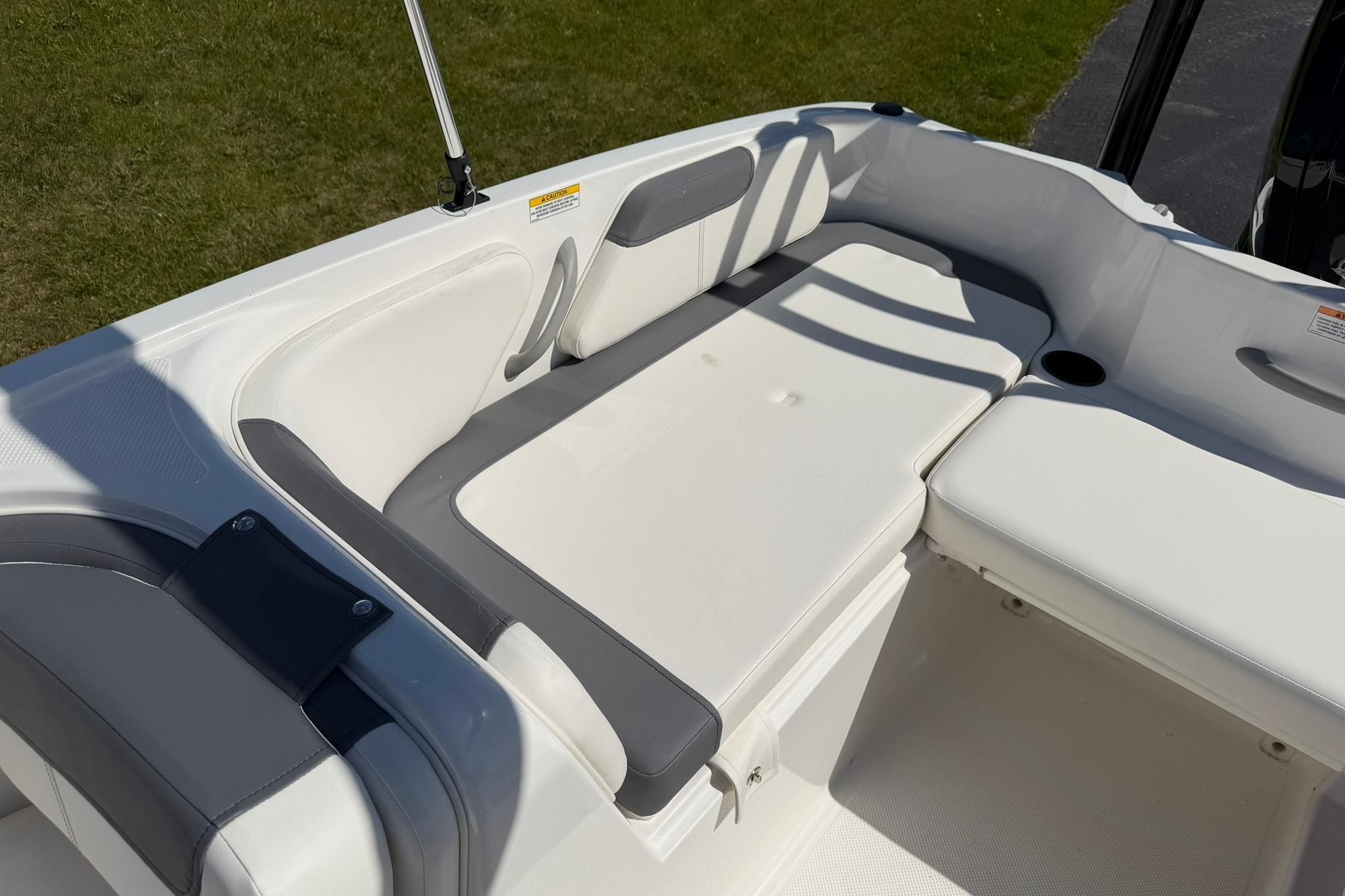 2026 Bayliner Element E18 boat interior with cushioned seating and sleek design.