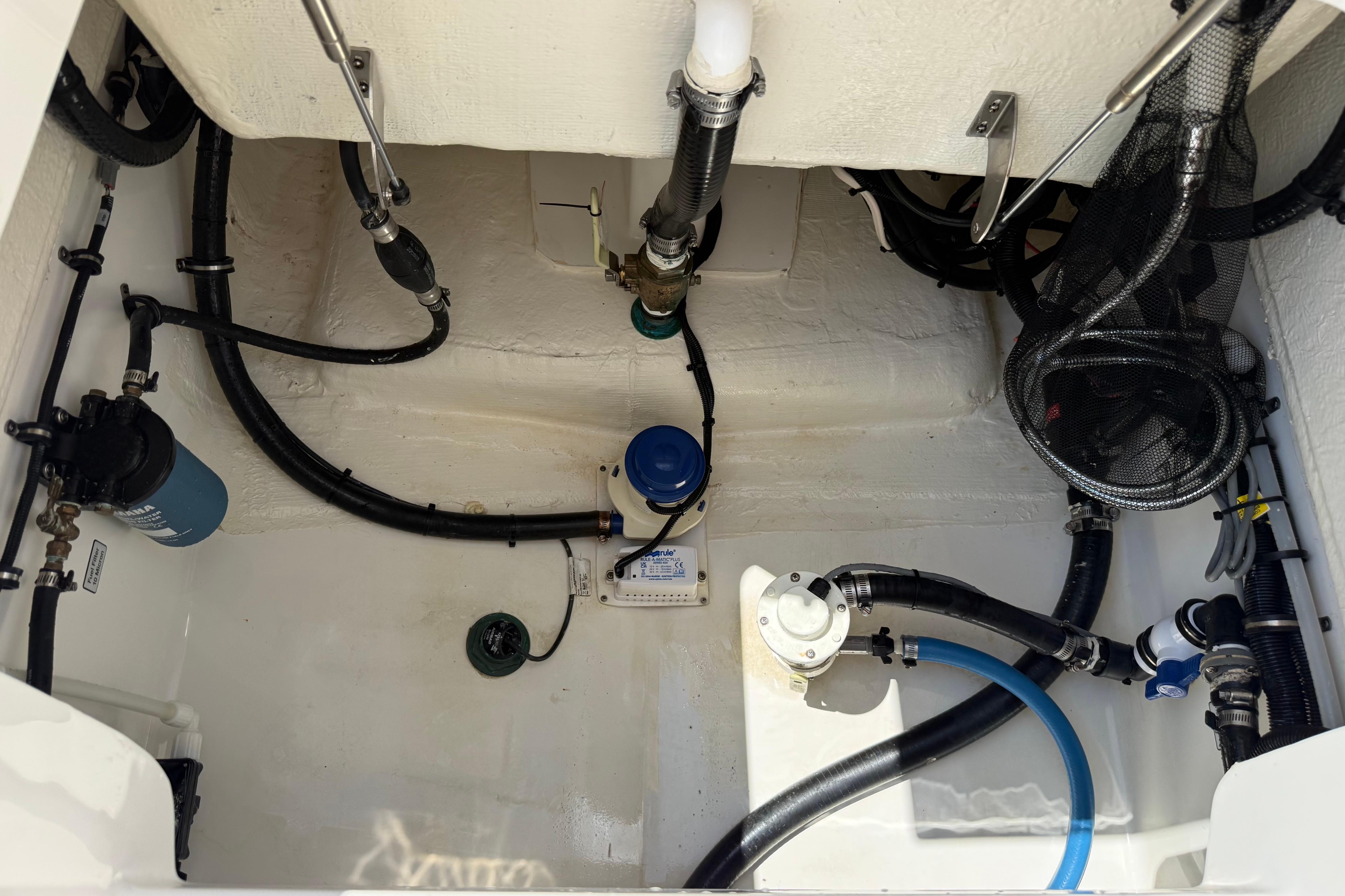 2023 Regulator 26XO boat interior showing plumbing and wiring components.